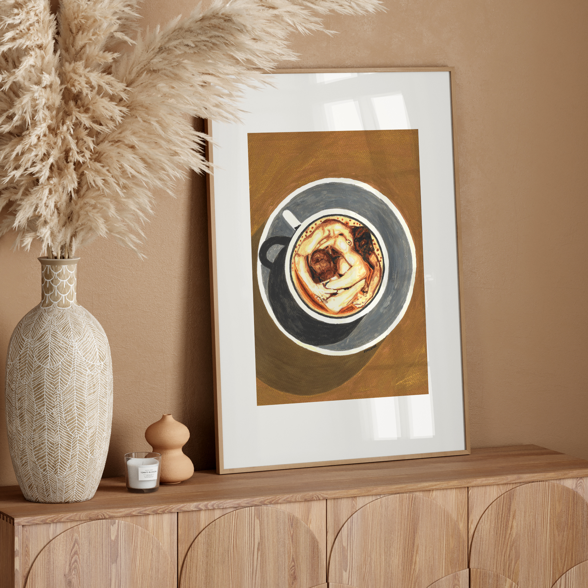 Framed artwork of a coffee cup on a wooden sideboard with decorative elements.
