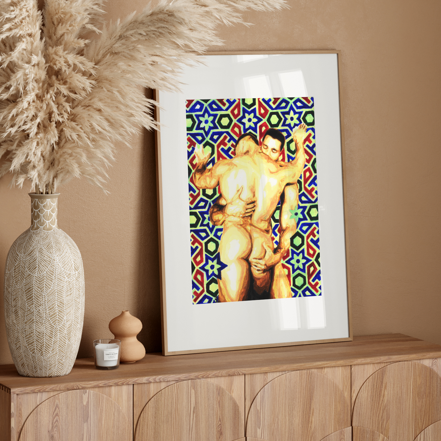 Framed artwork of a muscular figure with a colorful geometric pattern on a wooden sideboard.