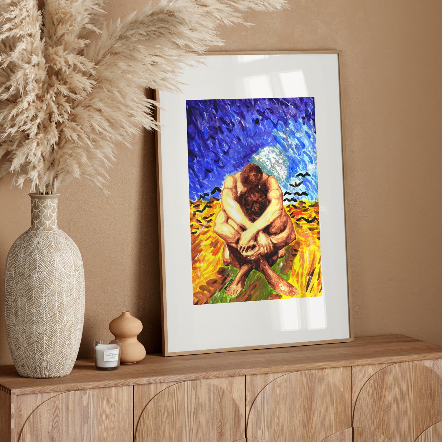 Framed artwork on a wooden console table with decorative elements.
