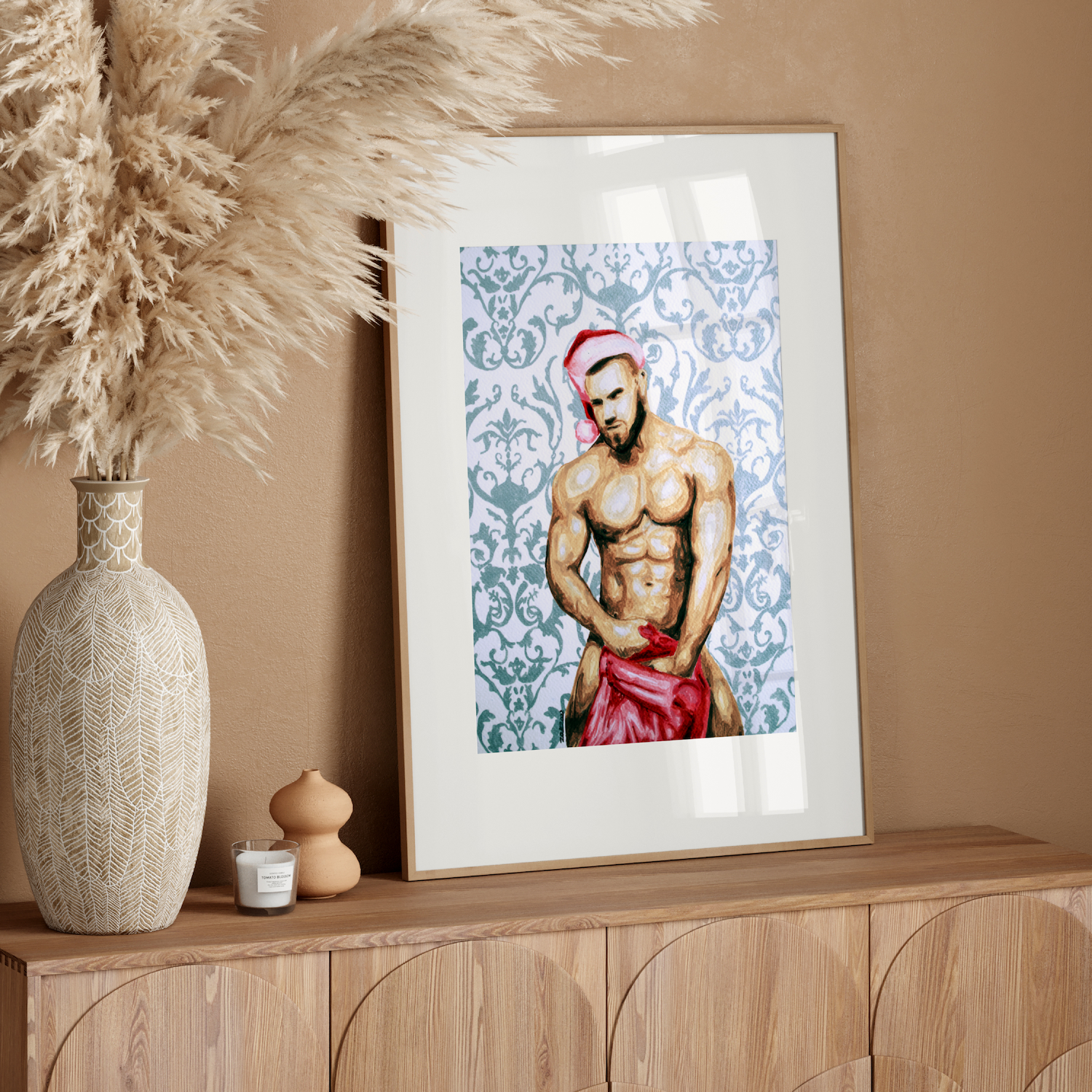 Framed artwork of a shirtless man on a wooden sideboard with decorative elements.