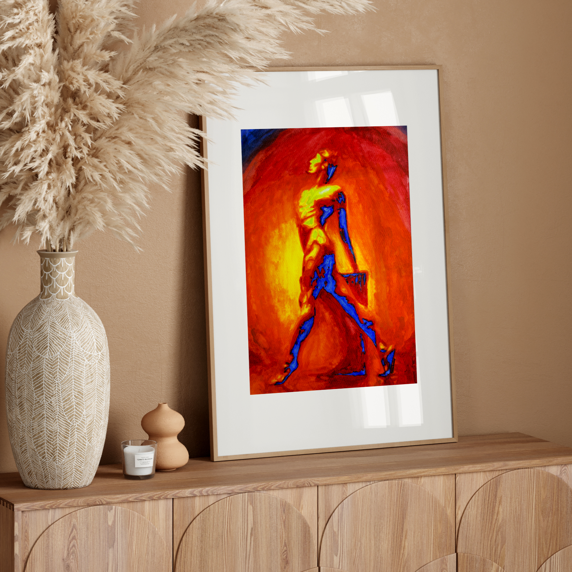 Framed abstract artwork on a wooden console table with decorative elements.