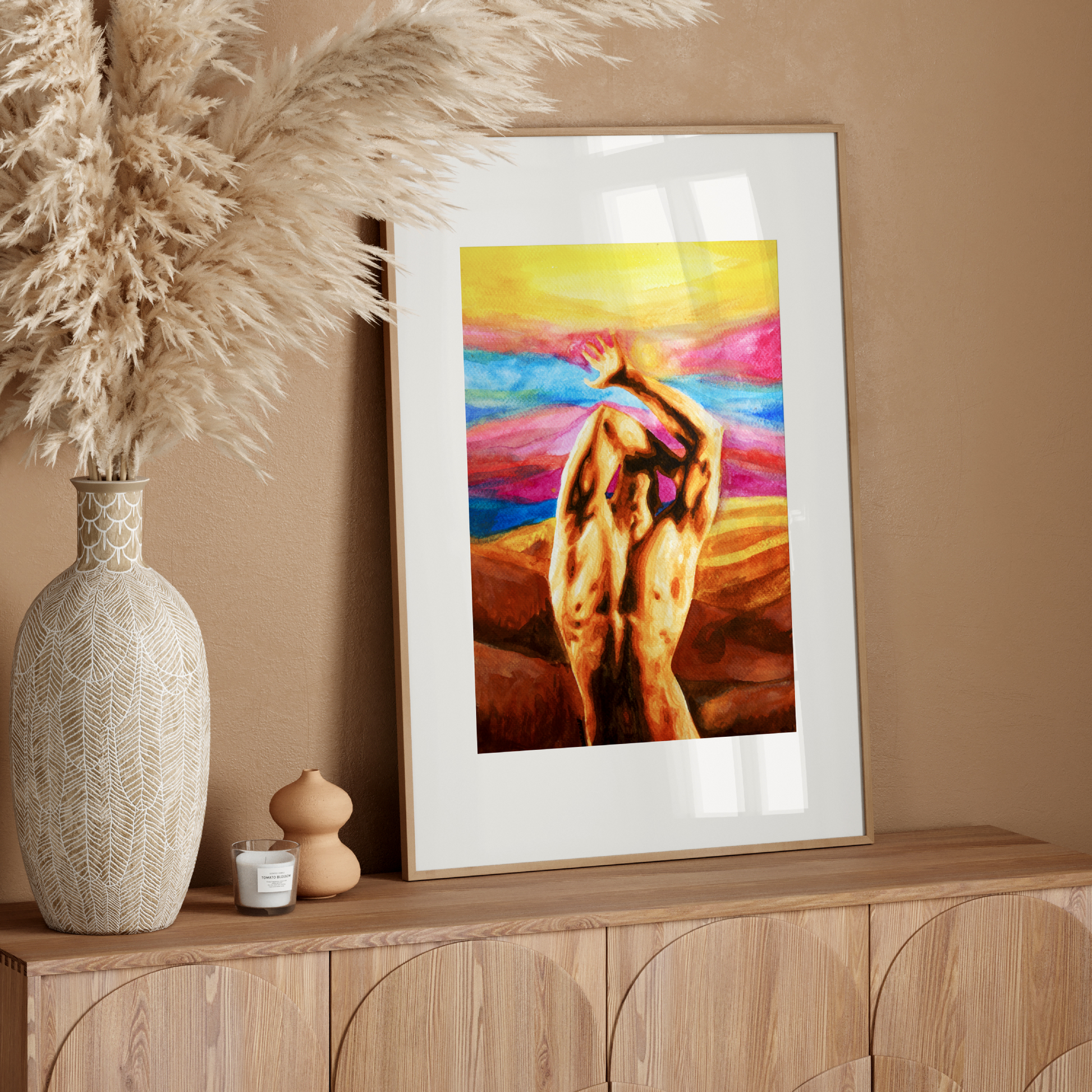 Framed artwork on a wooden console table with decorative elements.