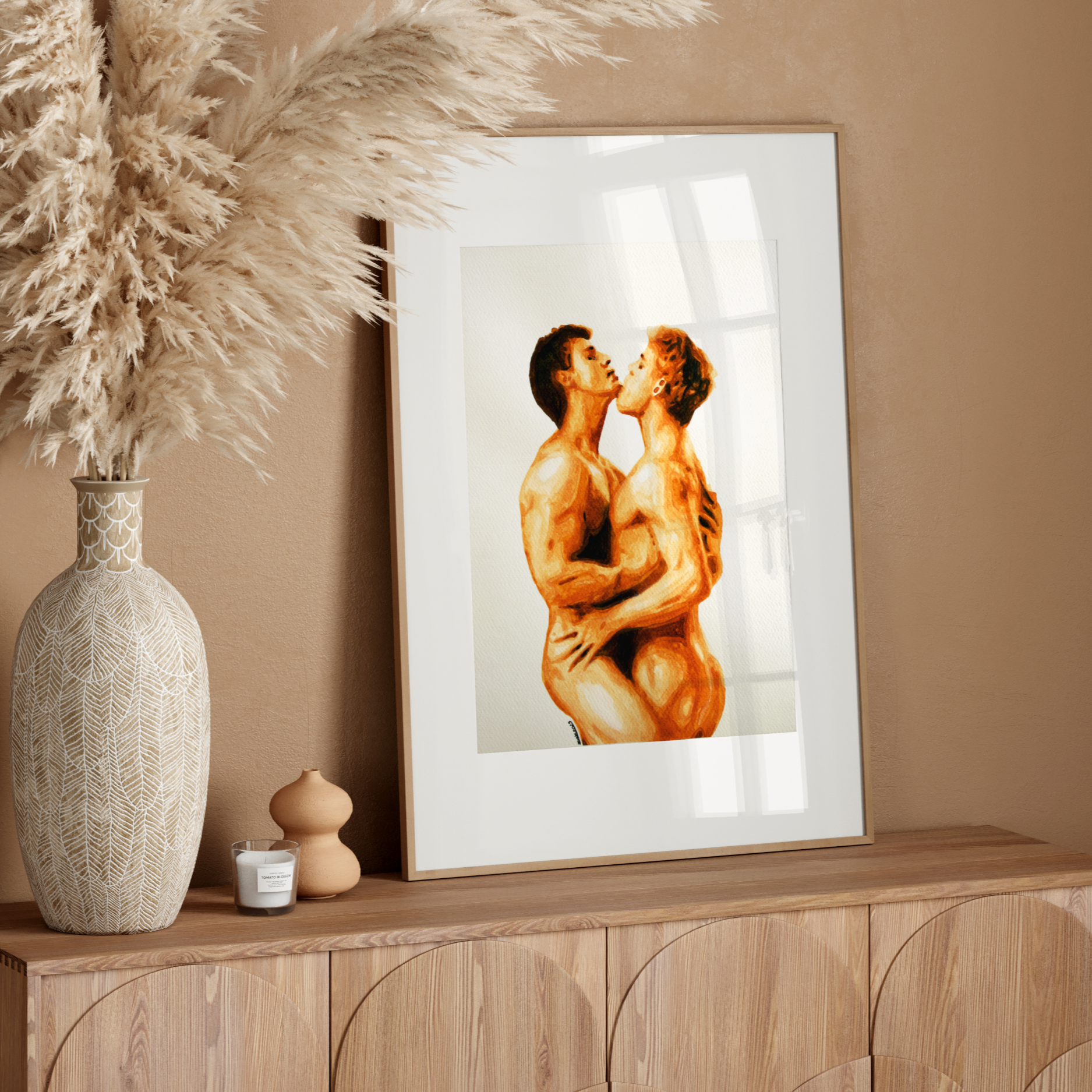 Framed artwork of two muscular figures on a wooden sideboard with decorative elements.