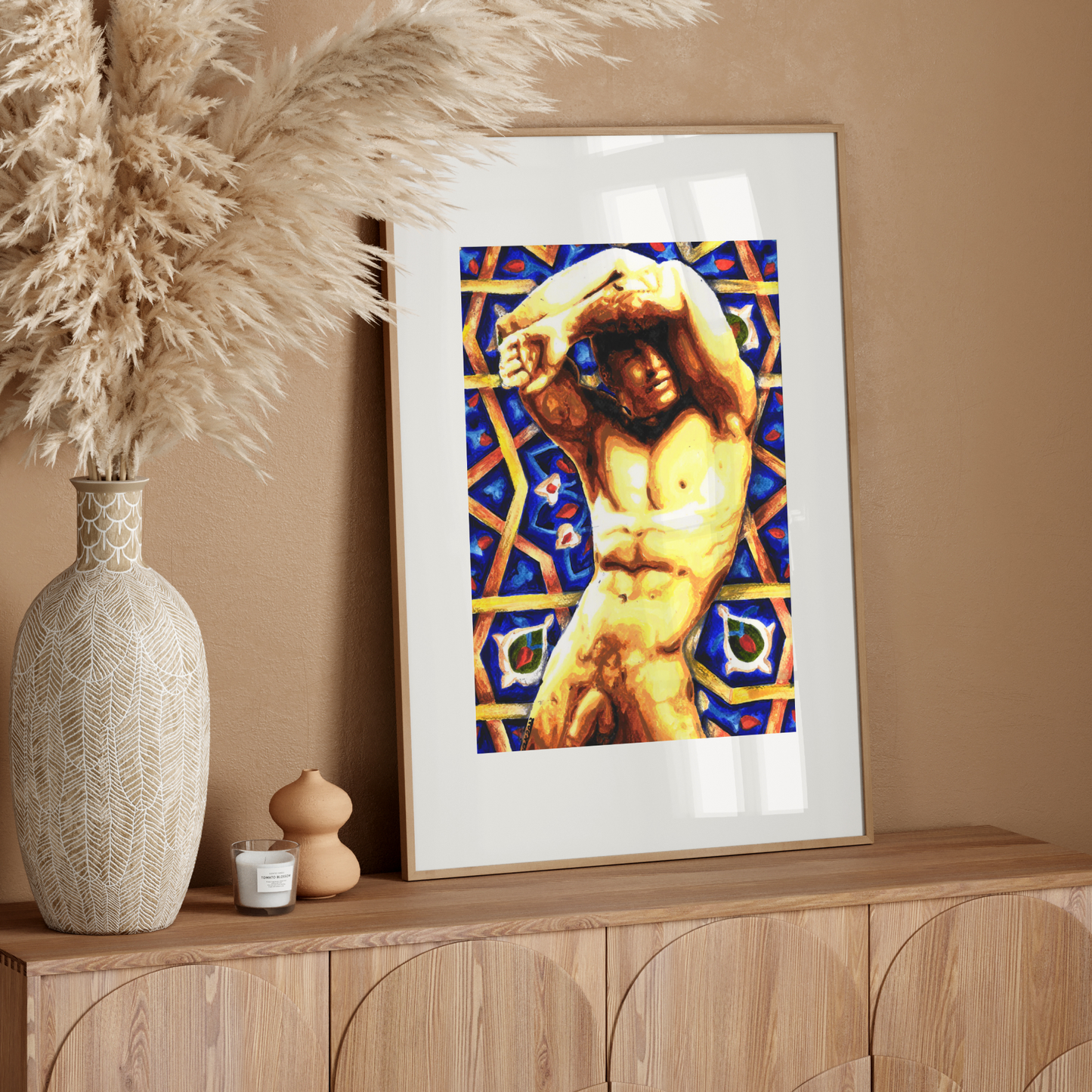 Framed artwork of a classical nude figure on a wooden sideboard with decorative elements.