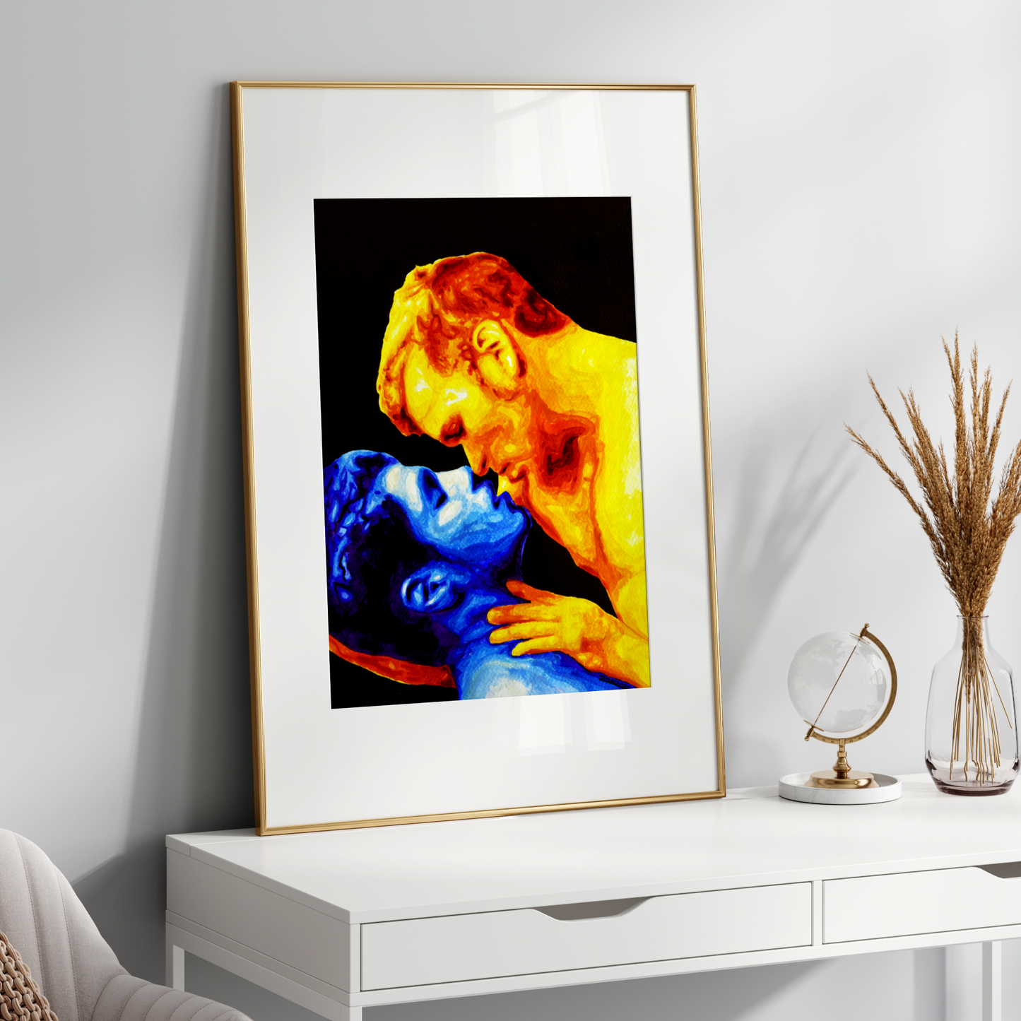 Framed artwork of a colorful depiction of a gay cople embracing on a white wall.
