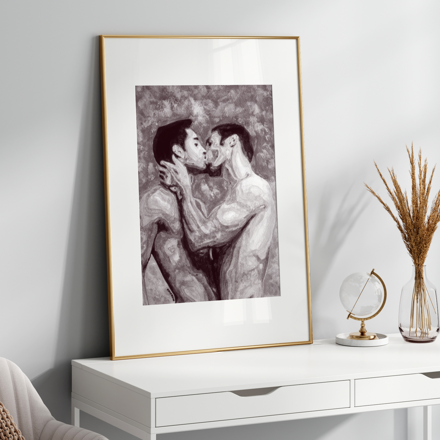 Framed black and white artwork on a white wall above a white console table.