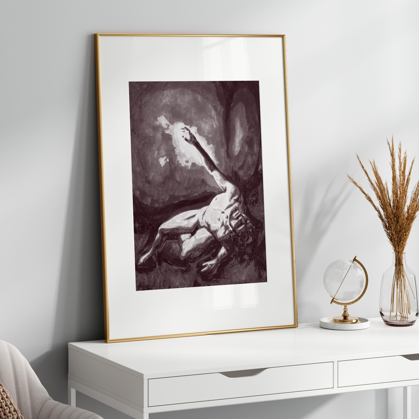 Framed artwork on a white wall above a white console table with decorative items.