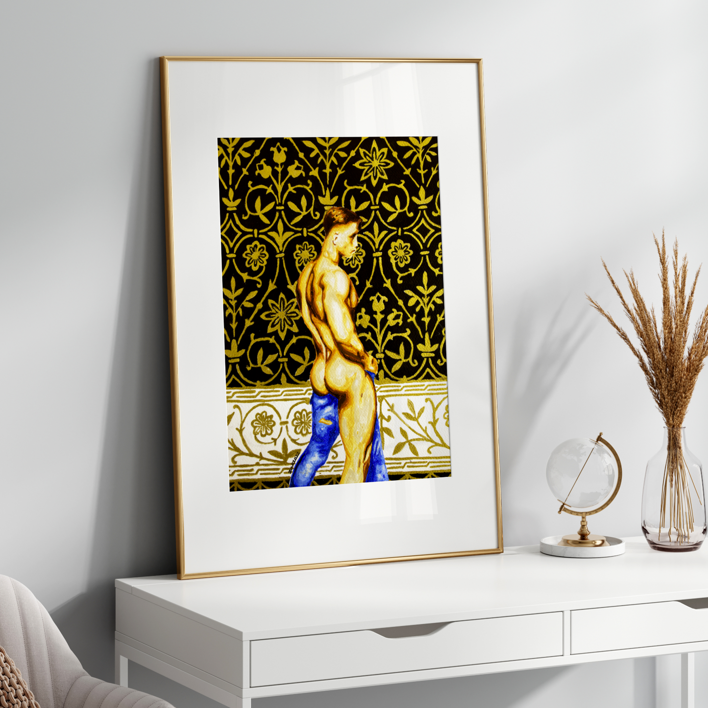 Framed artwork of a nude figure on a white wall above a white console table.