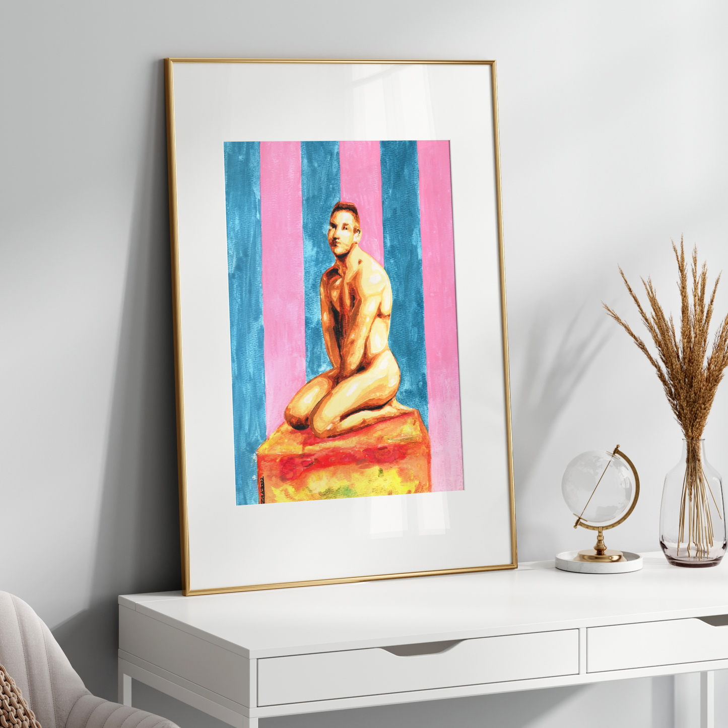 Framed artwork of a nude figure on a colorful striped background, displayed on a white wall above a white console table.