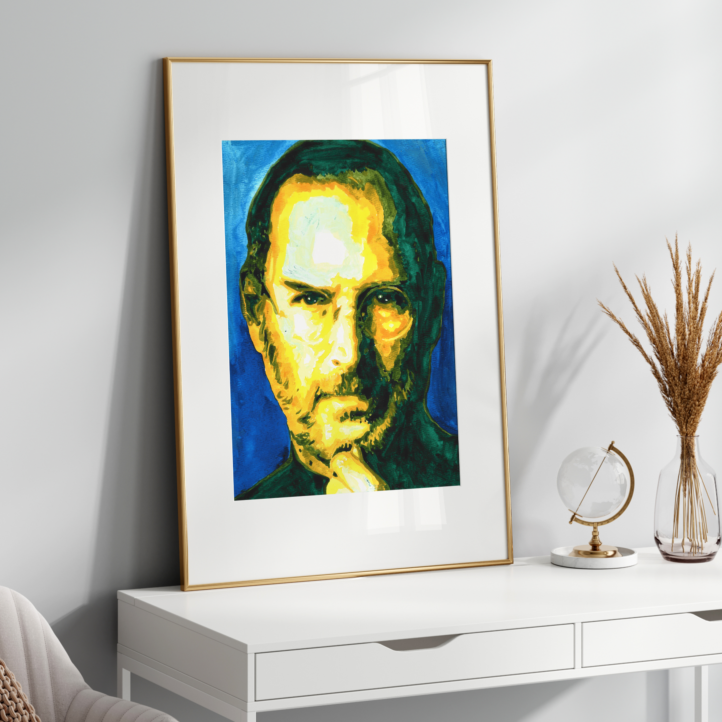 Framed portrait on a white wall above a white console table with decorative items.