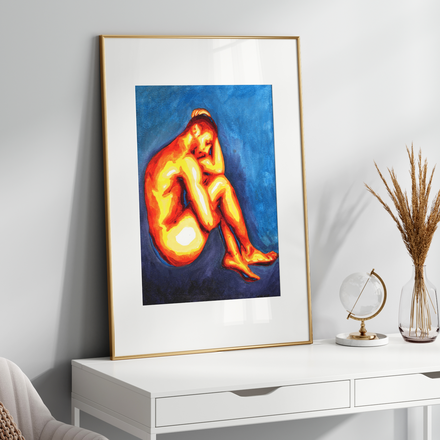 Framed artwork of a nude figure on a white console table with decorative items.