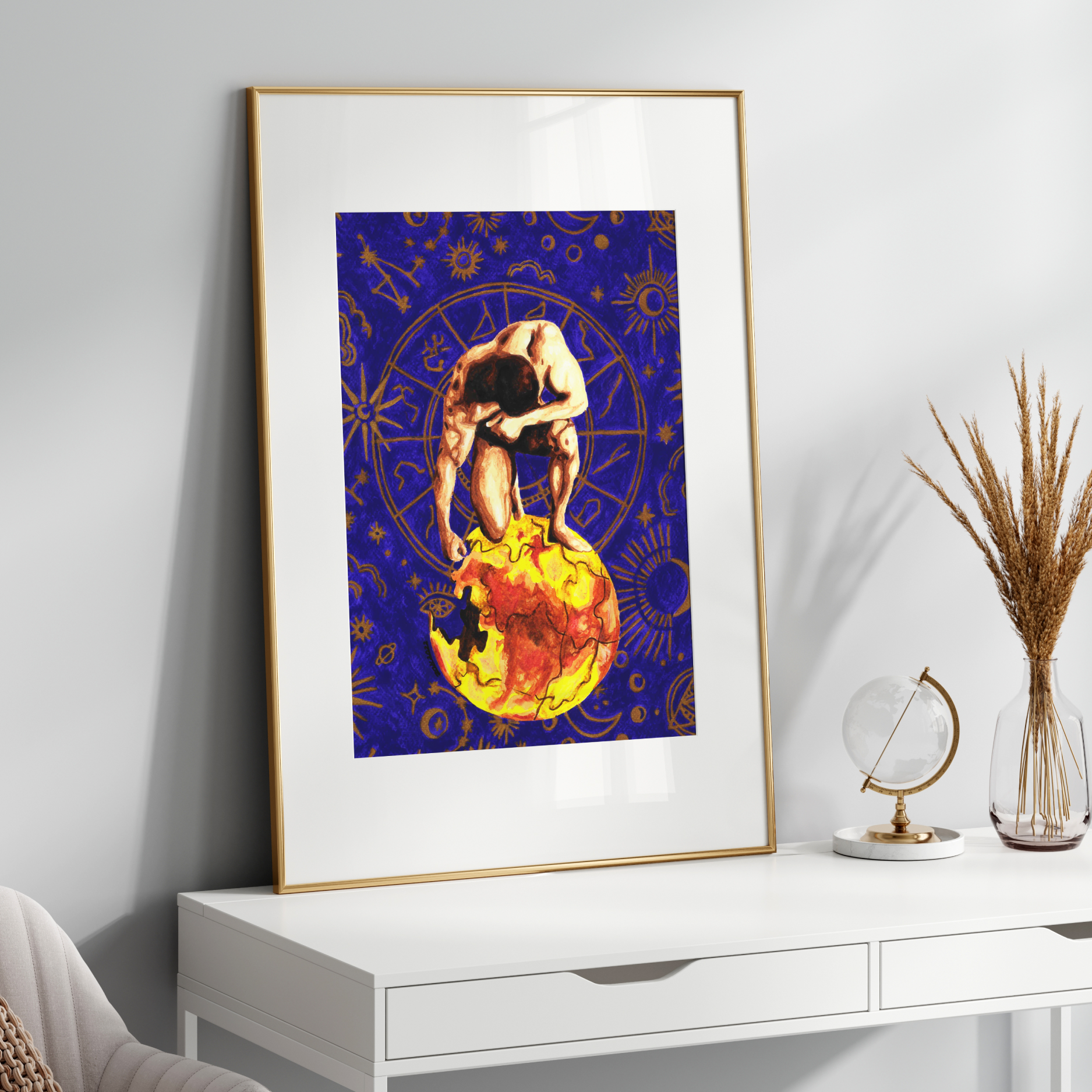 Framed artwork on a white wall above a white console table with decorative items.