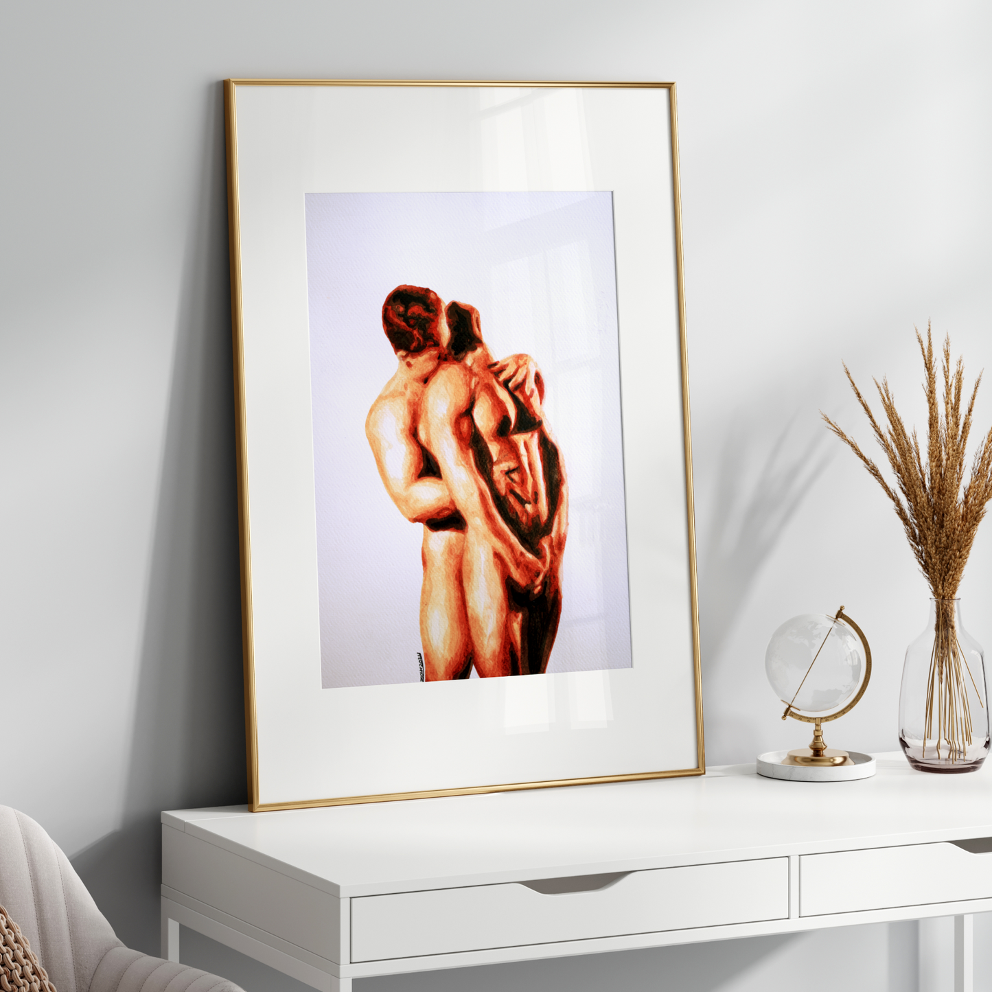 Framed artwork of two nude figures on a white console table with decorative items.