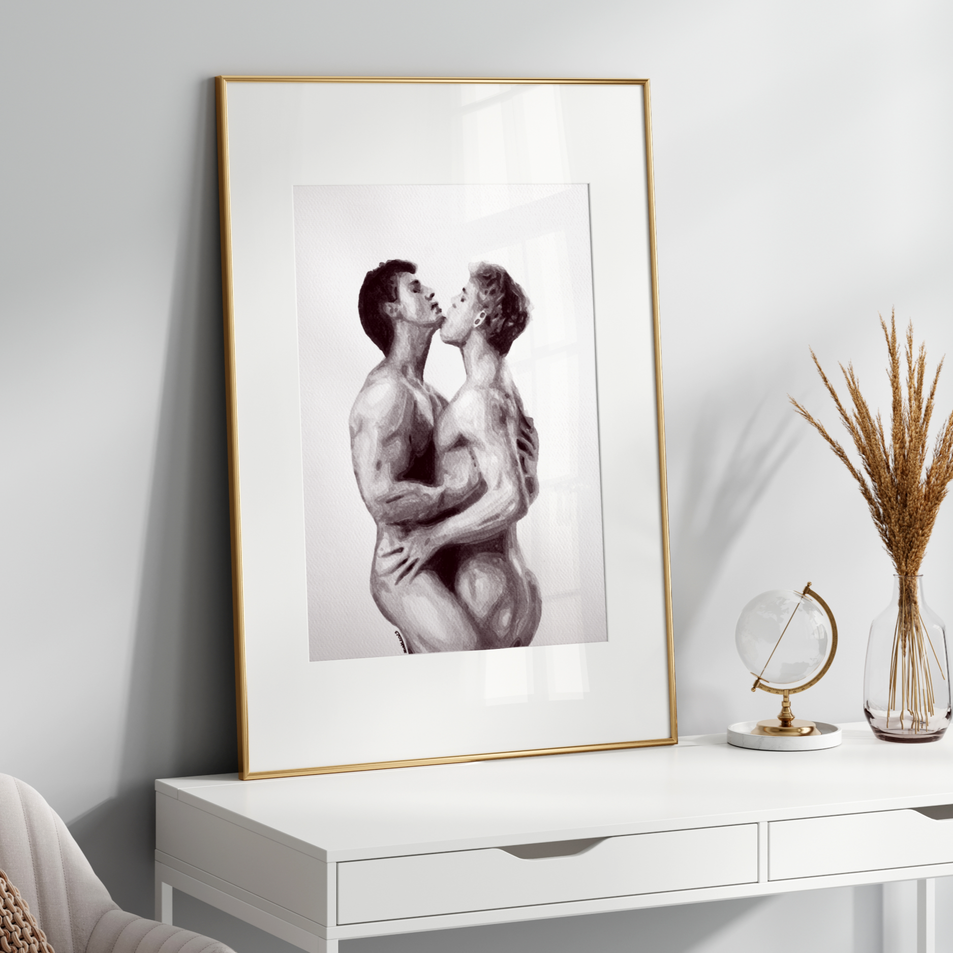 Framed artwork of two people embracing on a white wall above a white console table.
