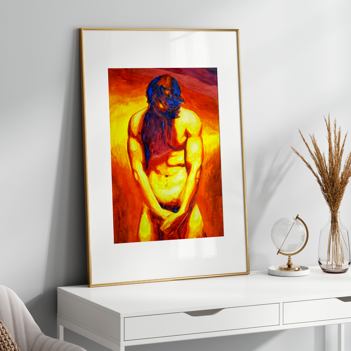 Framed abstract artwork on a white wall above a white console table.