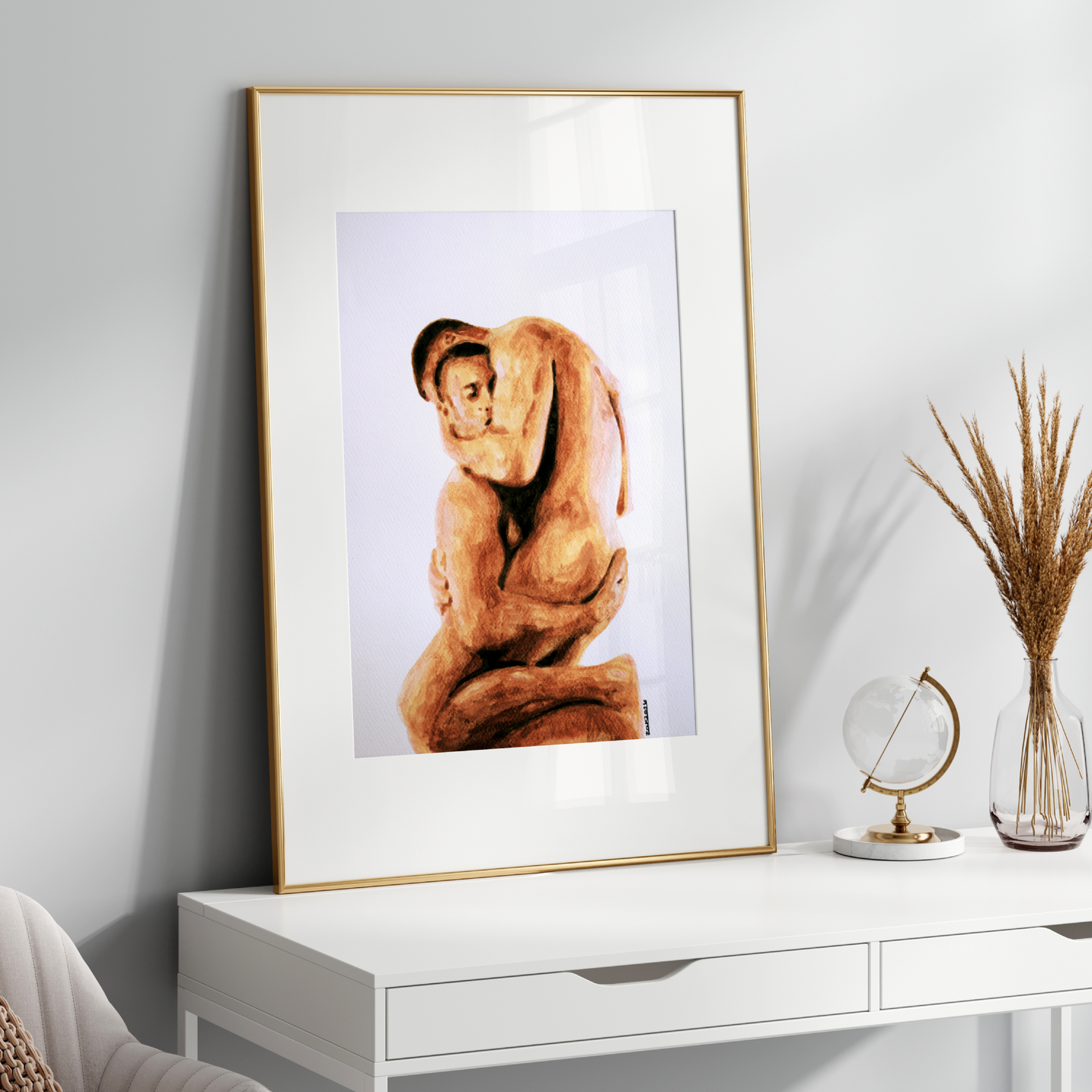 Framed artwork of a nude figure on a white console table with decorative items.