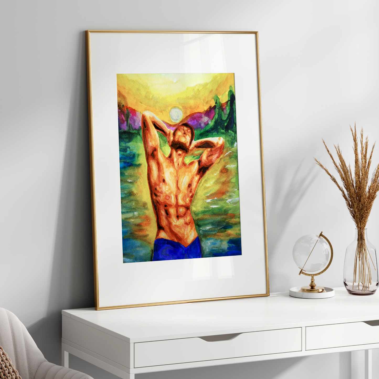 Framed artwork of a nude figure on a white wall above a white console table.