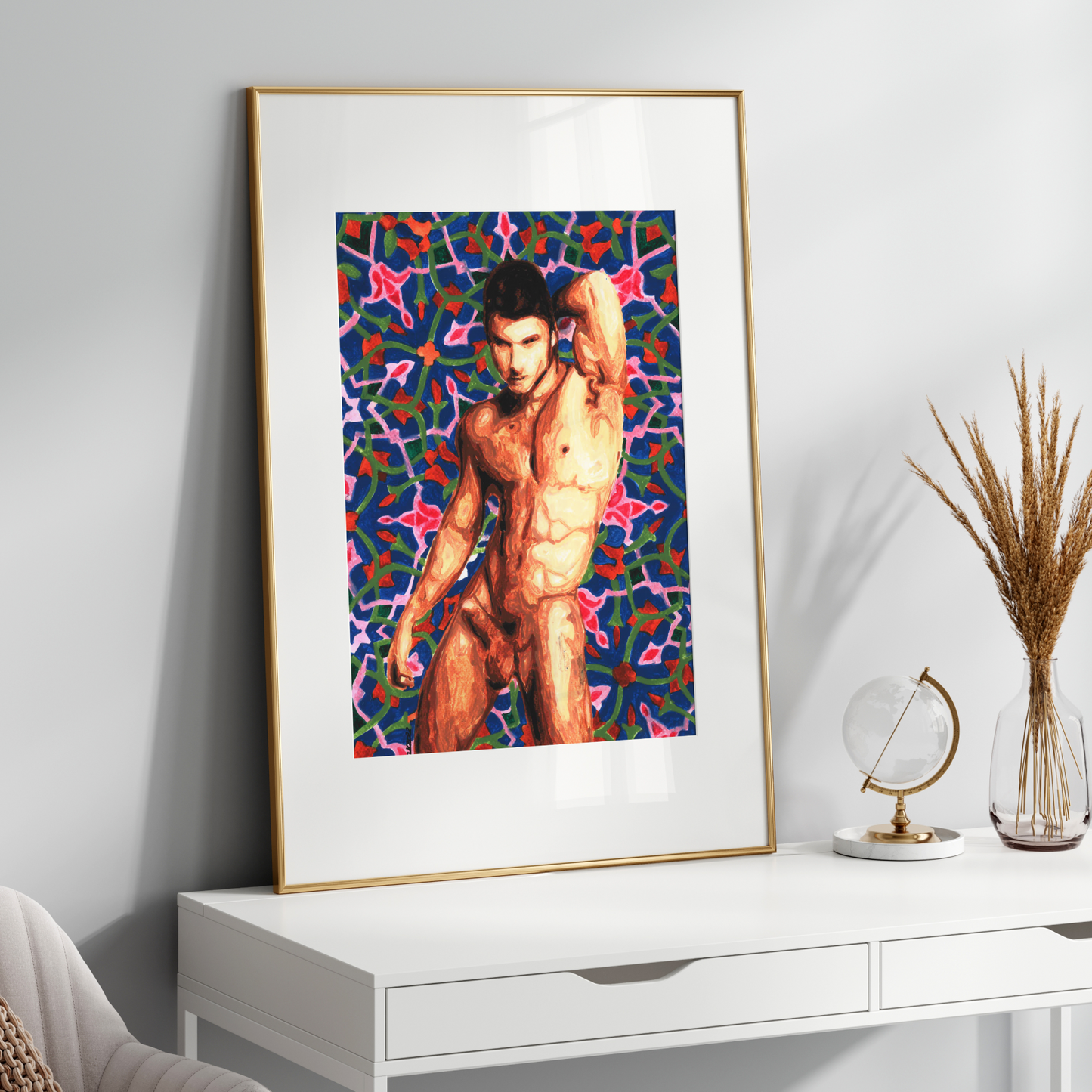 Framed artwork of a shirtless man against a colorful abstract background on a white wall.