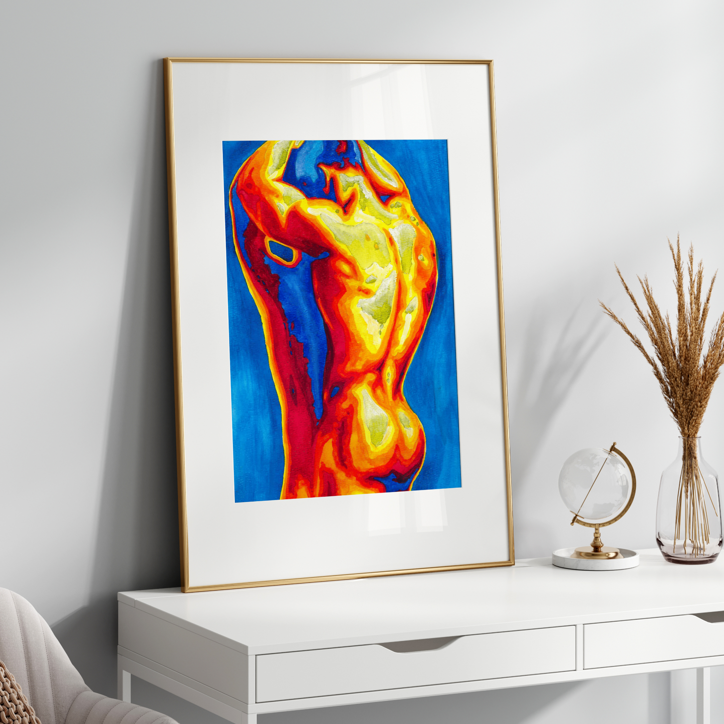 Framed colorful abstract art on a white wall above a white console table.