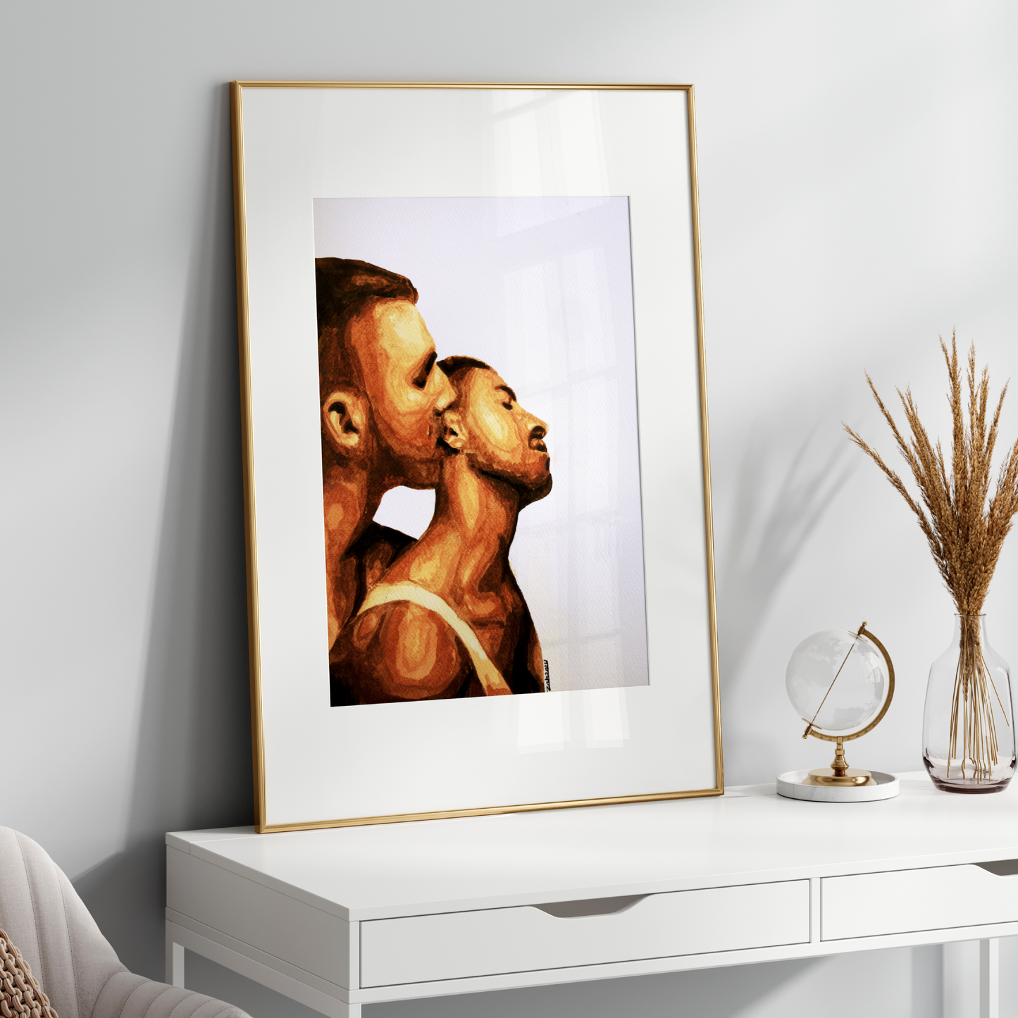 Framed artwork of two profiles on a white wall