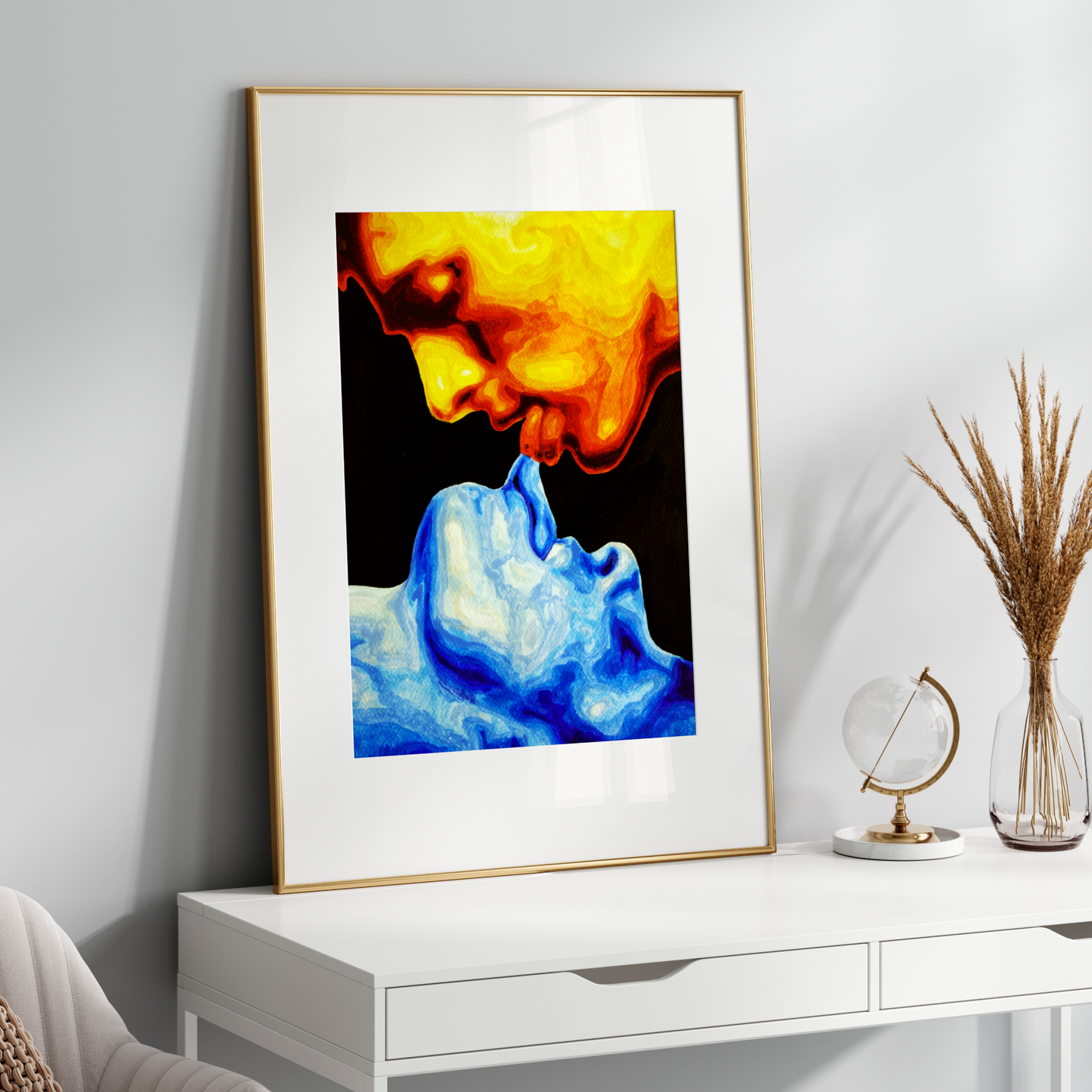 Framed abstract art piece on a white wall above a white console table.