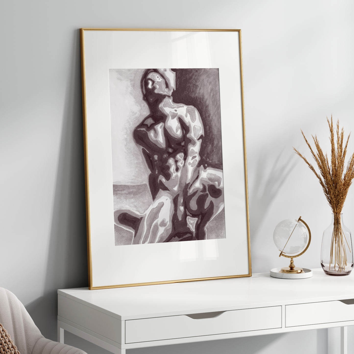Framed artwork on a white wall above a white console table with decorative items.