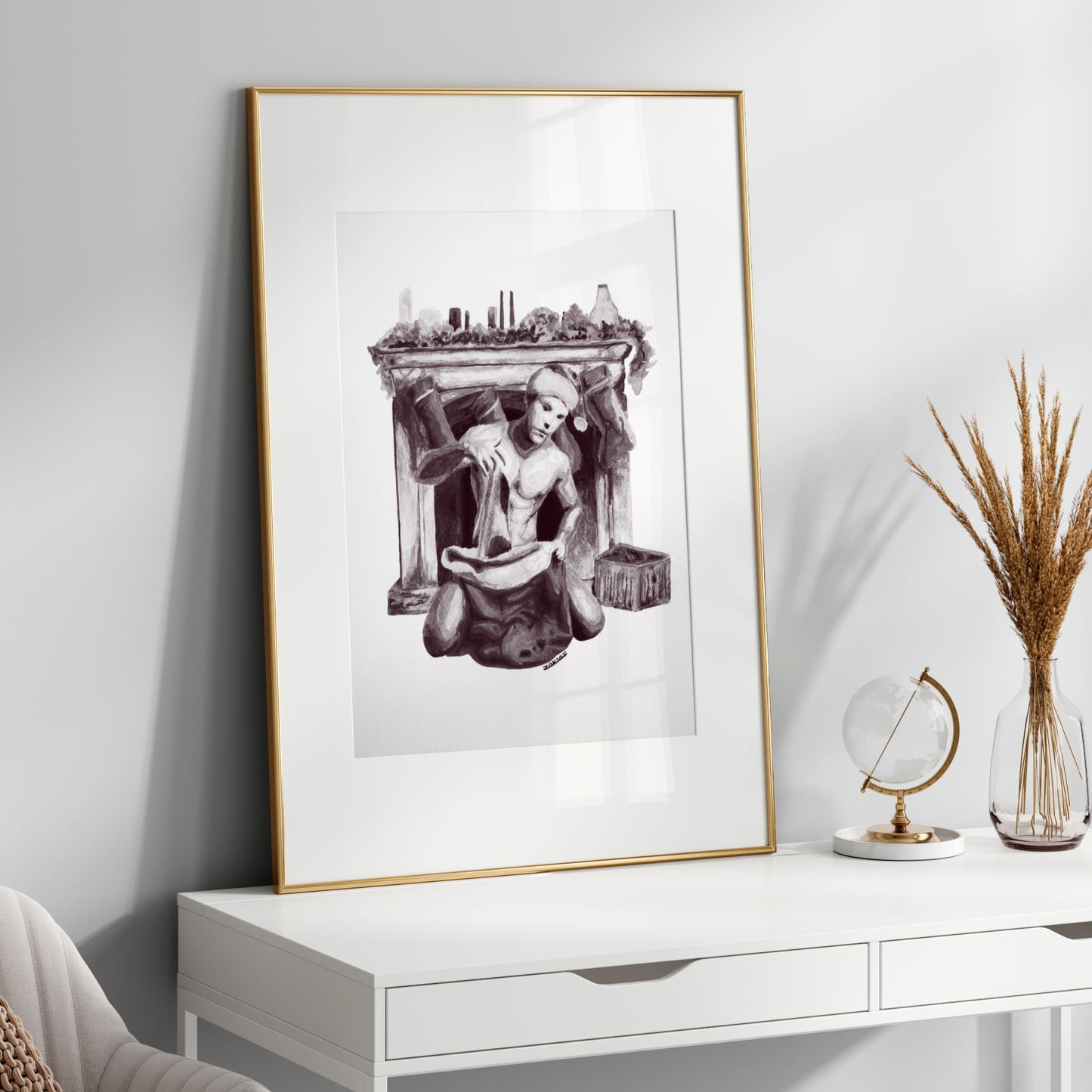 Framed artwork on a white wall above a white console table with decorative items.