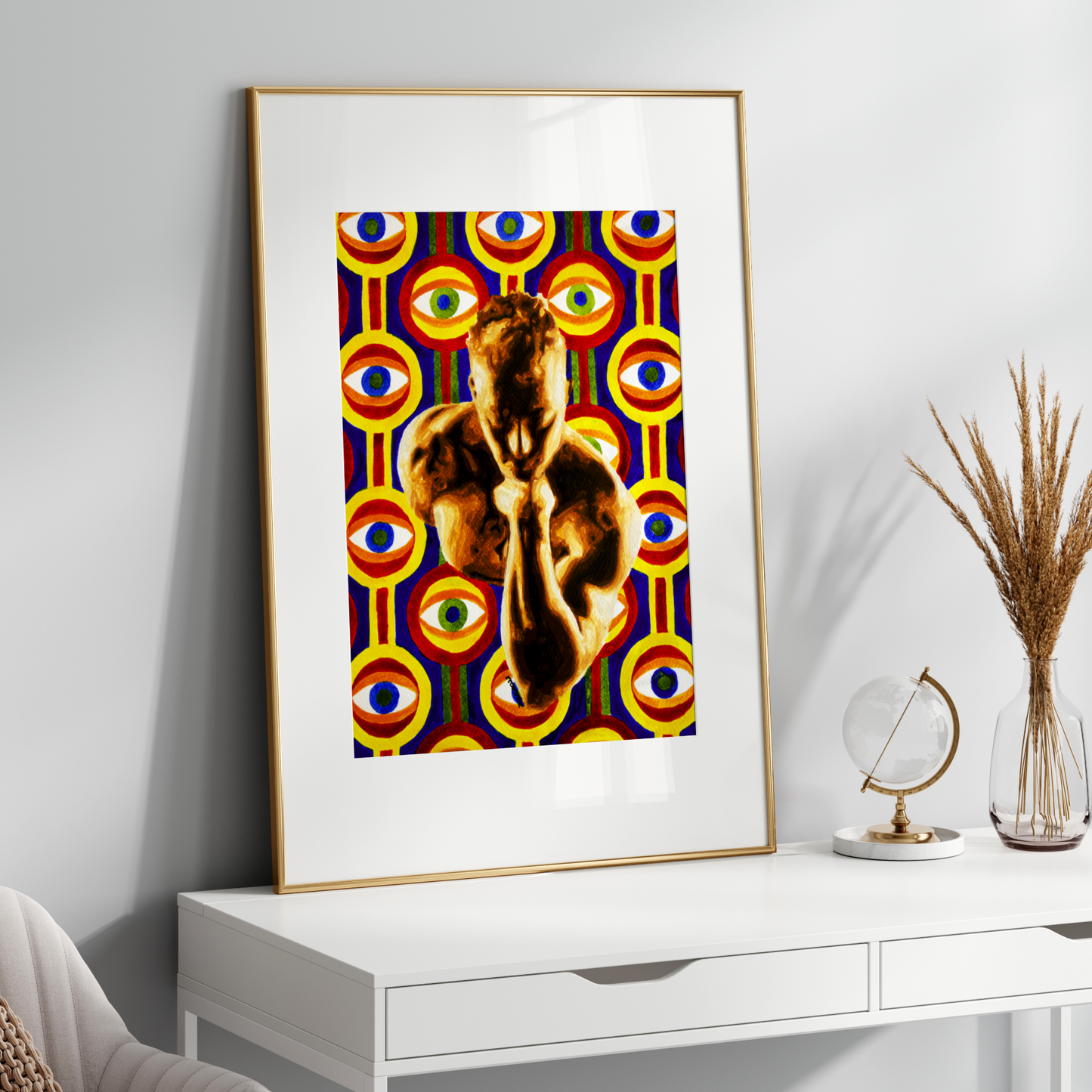 Framed abstract artwork on a white wall above a white console table.