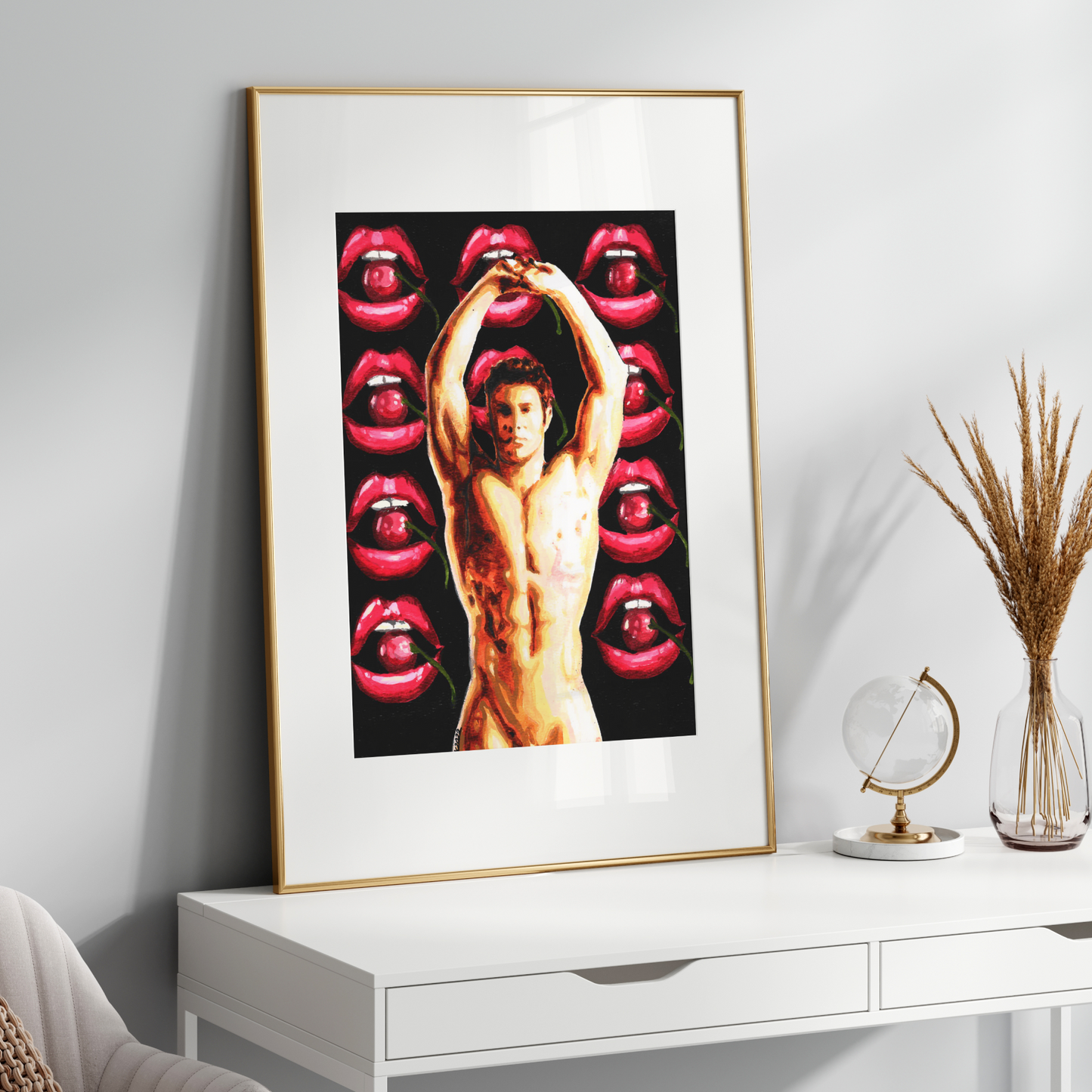 Framed artwork on a white wall with decorative items below.