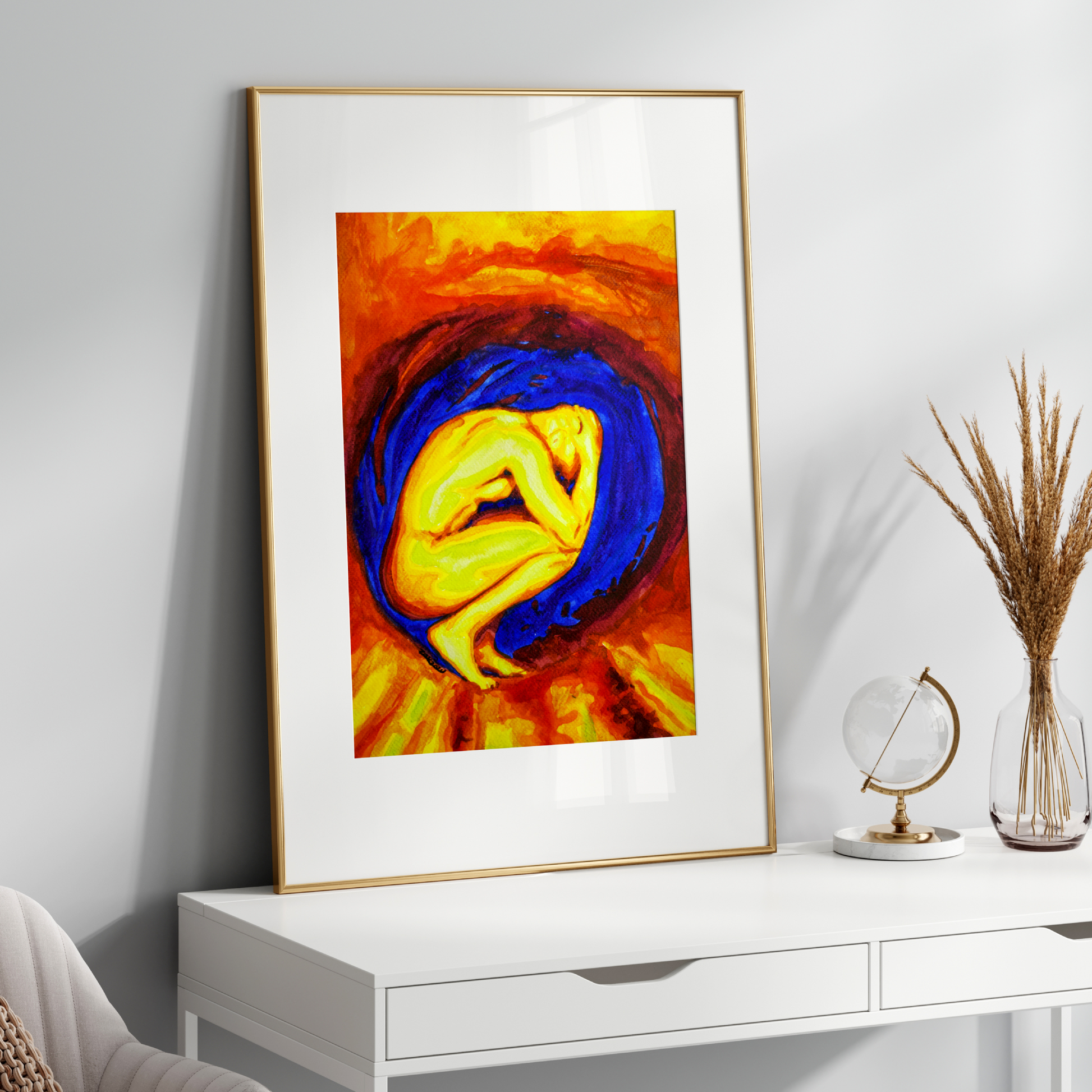 Framed abstract artwork on a white wall above a white console table.