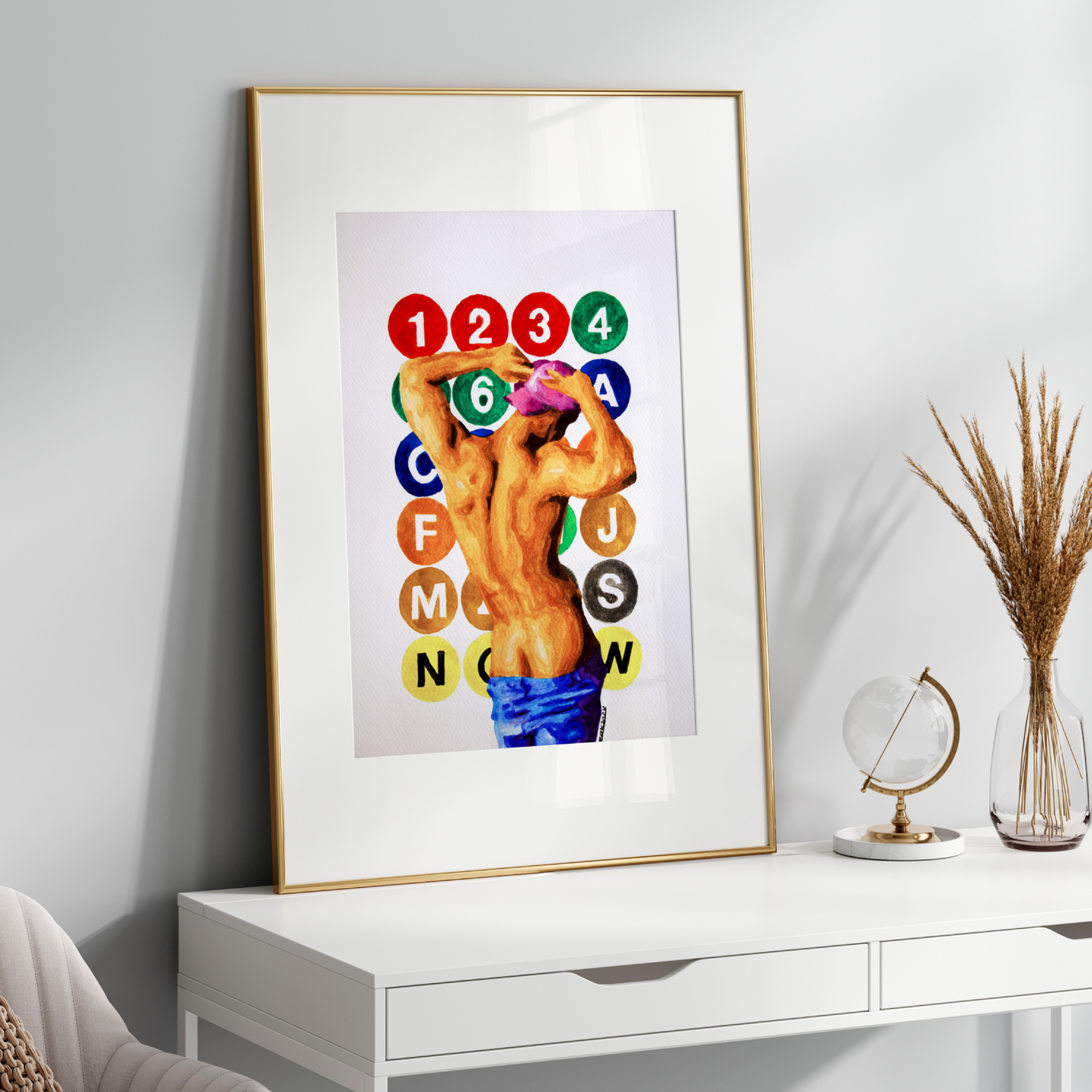 Framed artwork on a white wall above a white console table with decorative items.