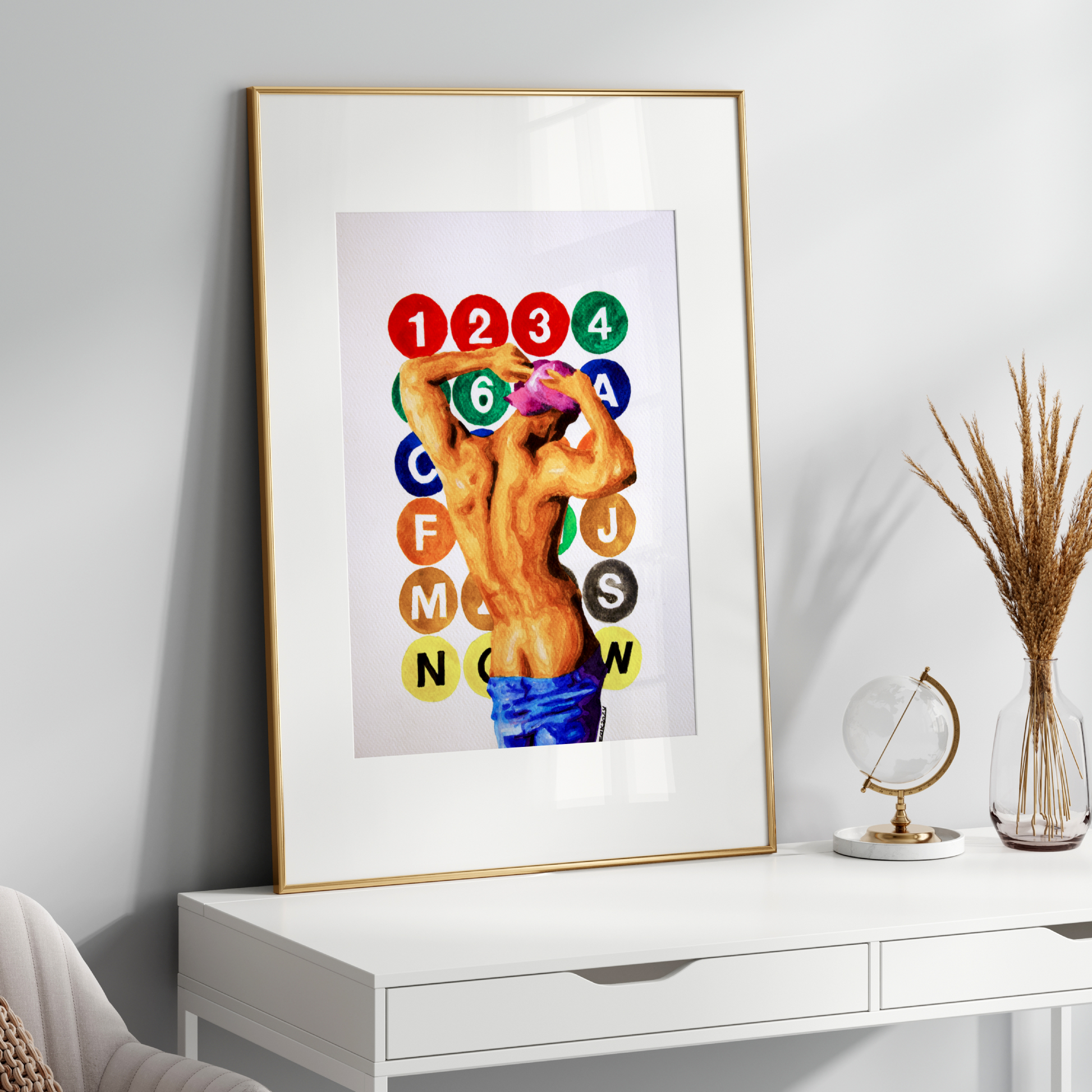 Framed artwork on a white wall above a white console table with decorative items.