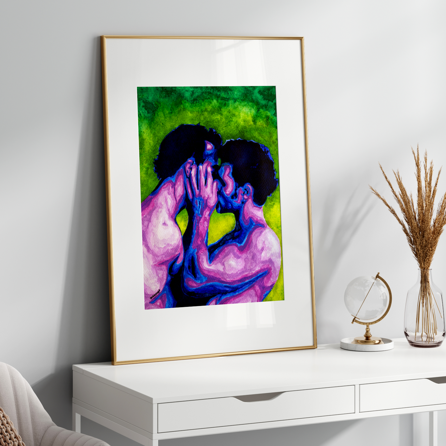 Framed artwork of two people embracing on a white wall above a white console table.
