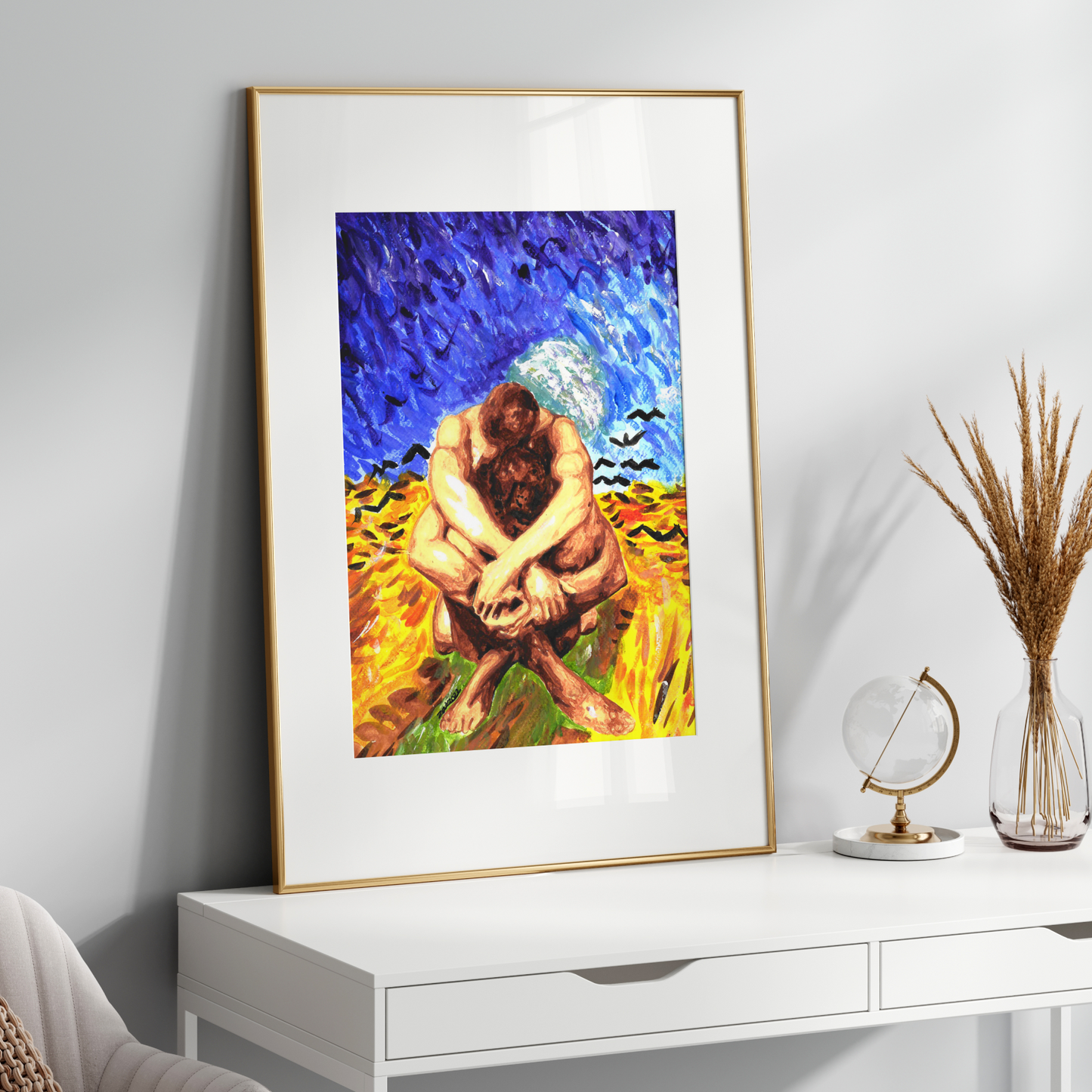 Framed artwork of a couple embracing in a field on a white wall above a white console table.
