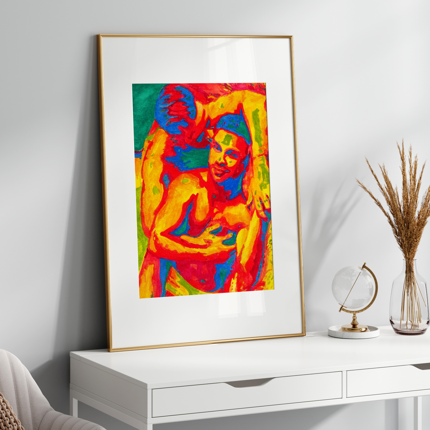 Framed colorful artwork of gay couple kissing on a white wall