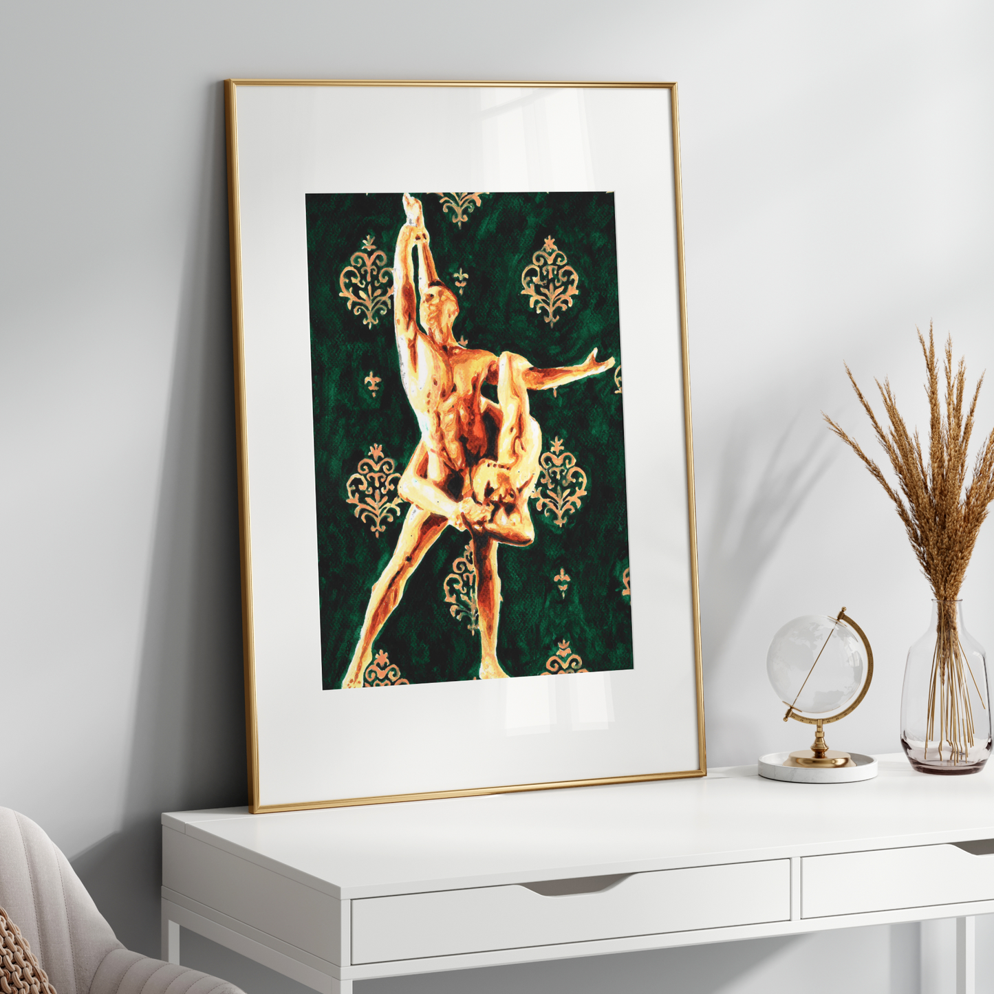 Framed artwork of a dancer on a white surface with decorative items.