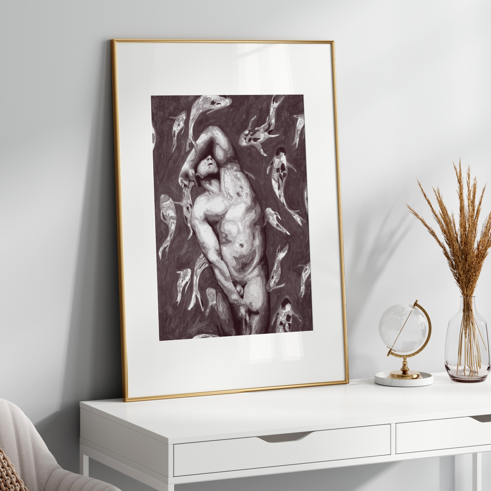 Framed artwork on a white wall above a white console table with decorative items.