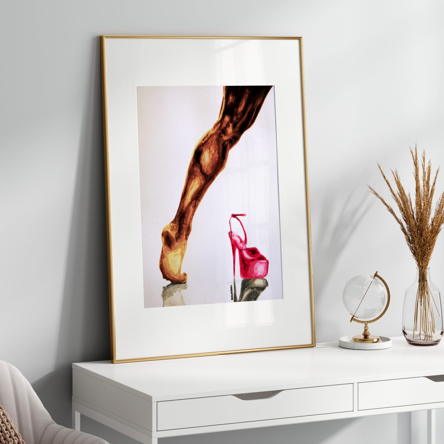Framed artwork on a white wall above a white console table with decorative items.