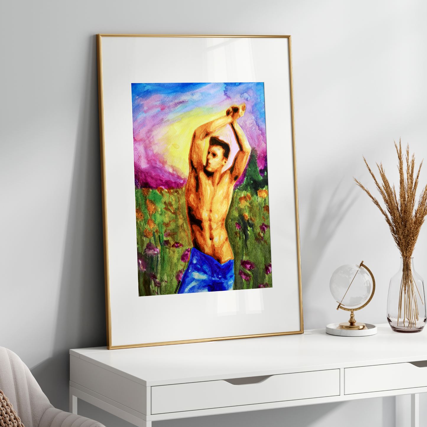 Framed artwork of a person in a field on a white console table with decorative items.