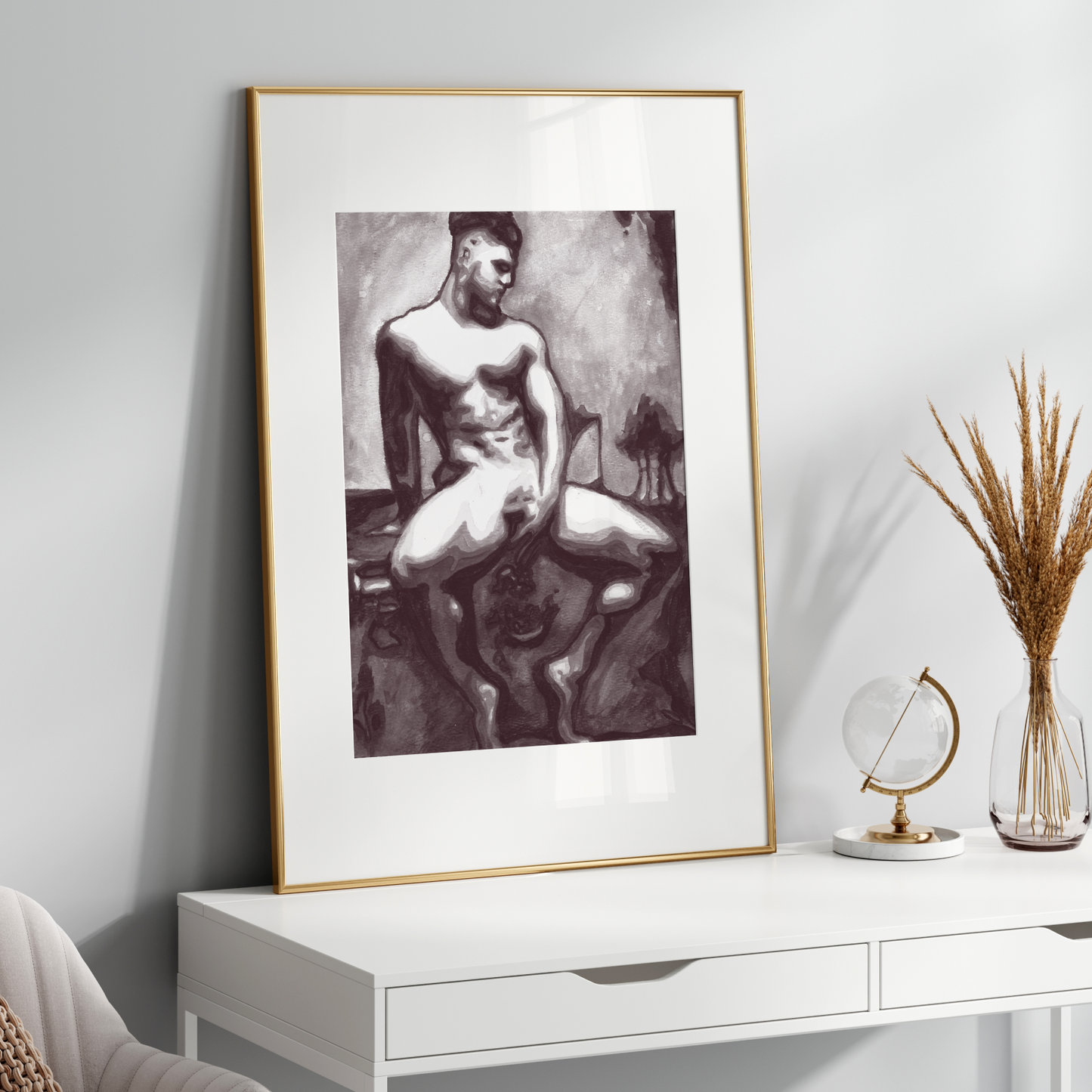 Framed black and white artwork on a white wall above a white console table with decorative items.