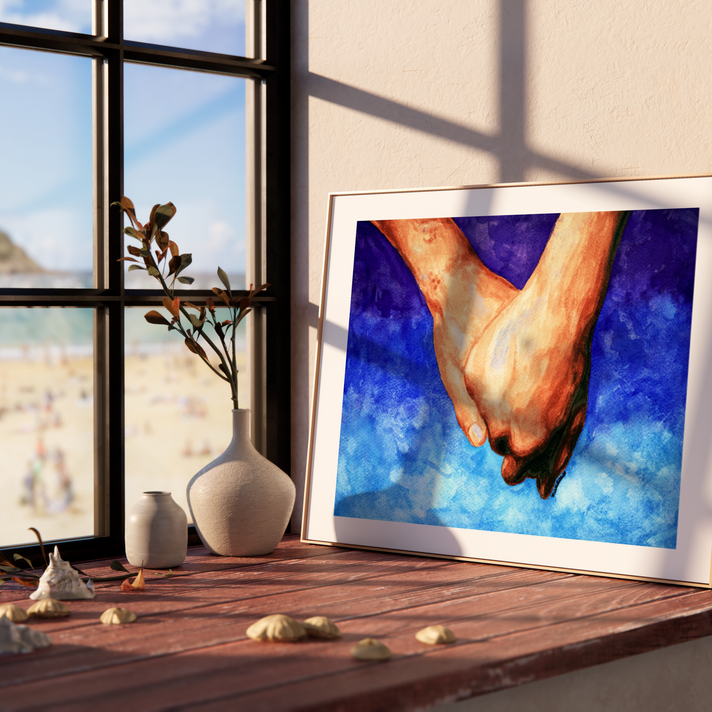 Framed artwork of two hands holding each other on a shelf with a window view.