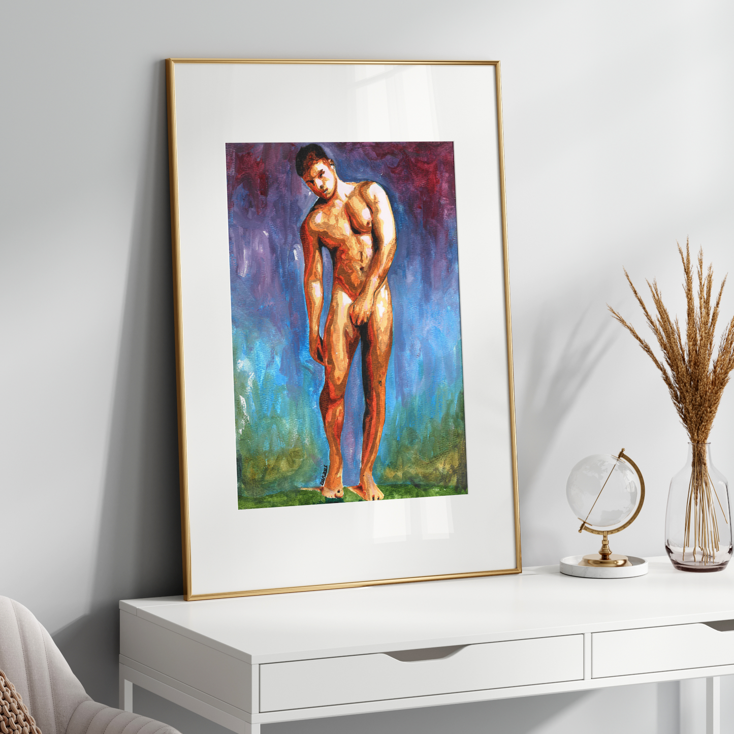 Framed artwork of a nude figure on a white wall above a white console table.