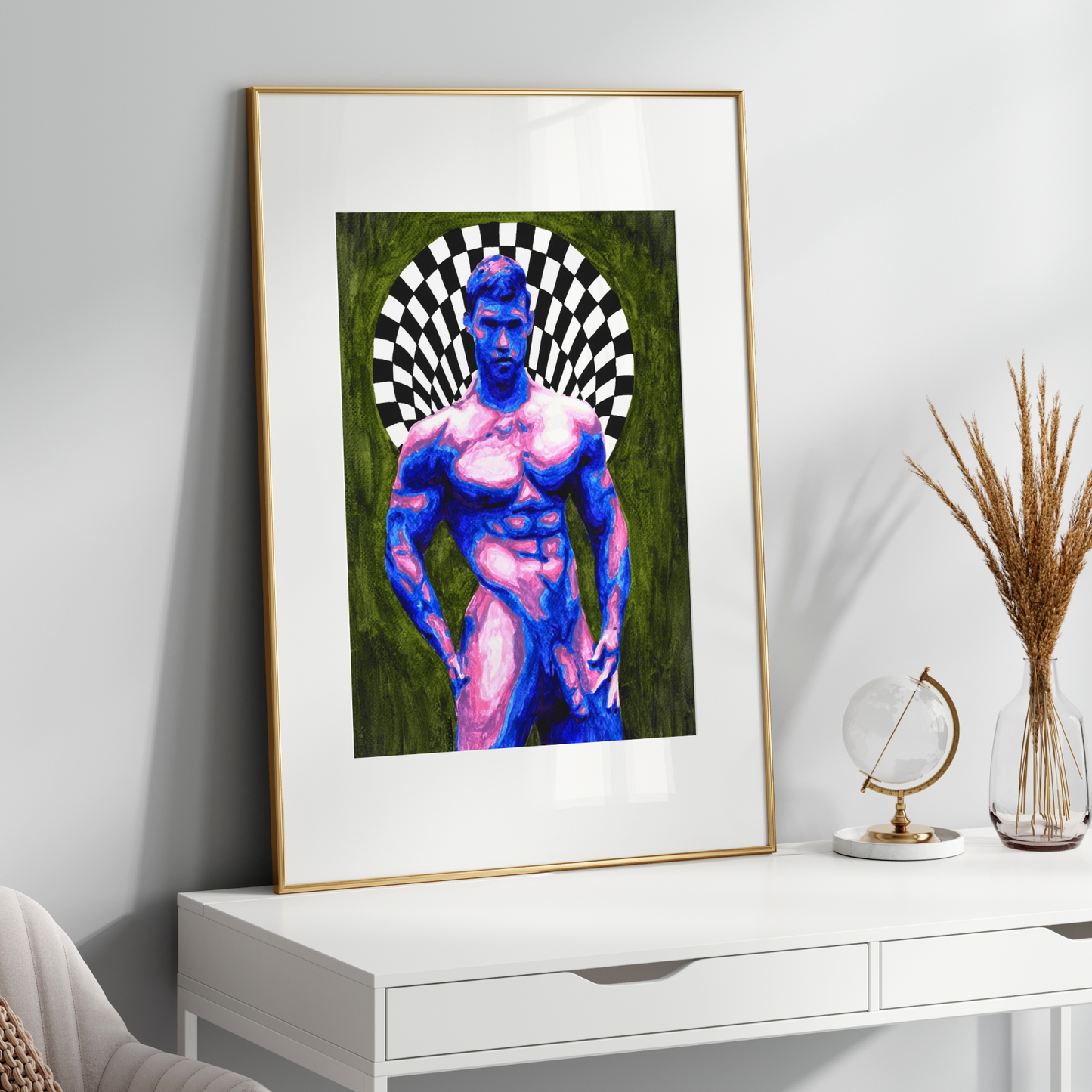 Framed artwork of a stylized human figure on a white surface with decorative items.