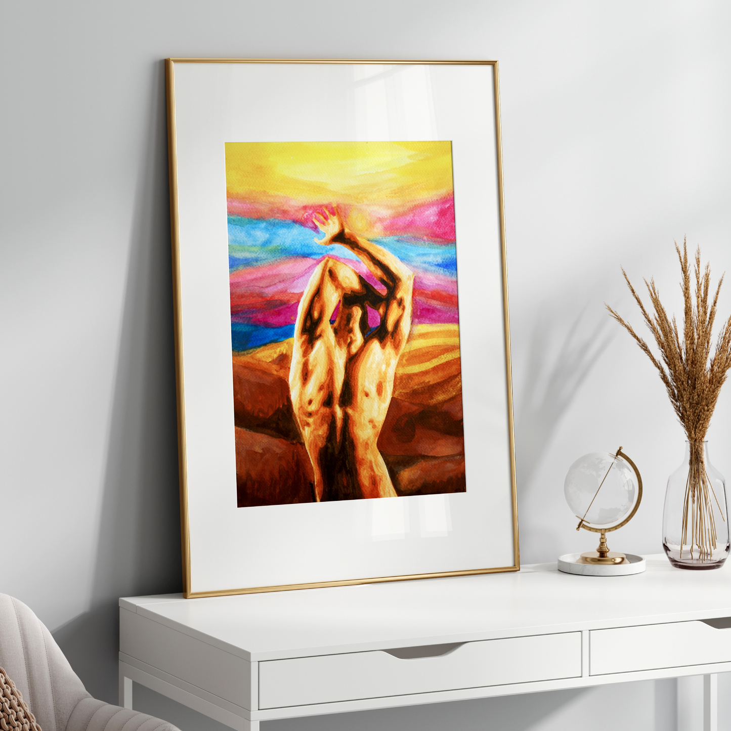 Framed abstract artwork of a nude figure on a white wall above a white console table.