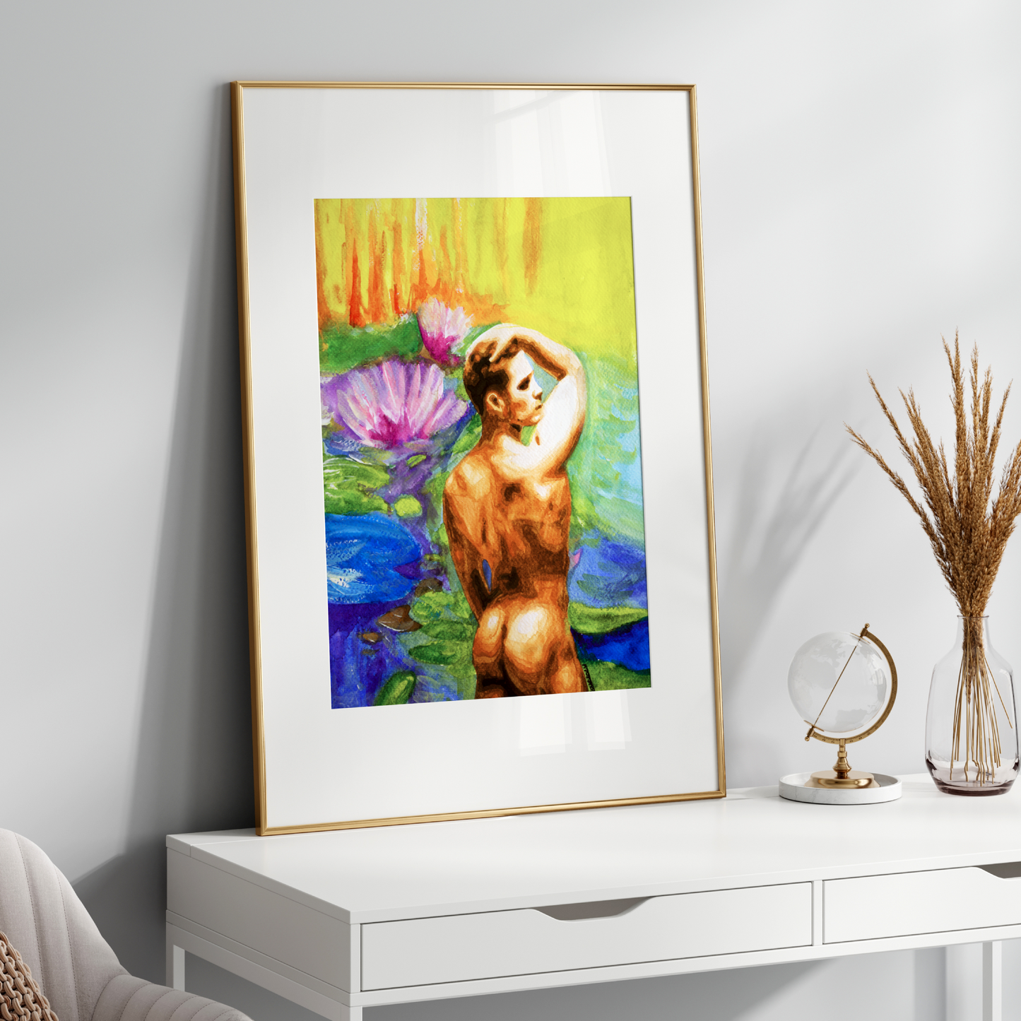 Framed artwork of a nude figure with floral elements on a white surface.