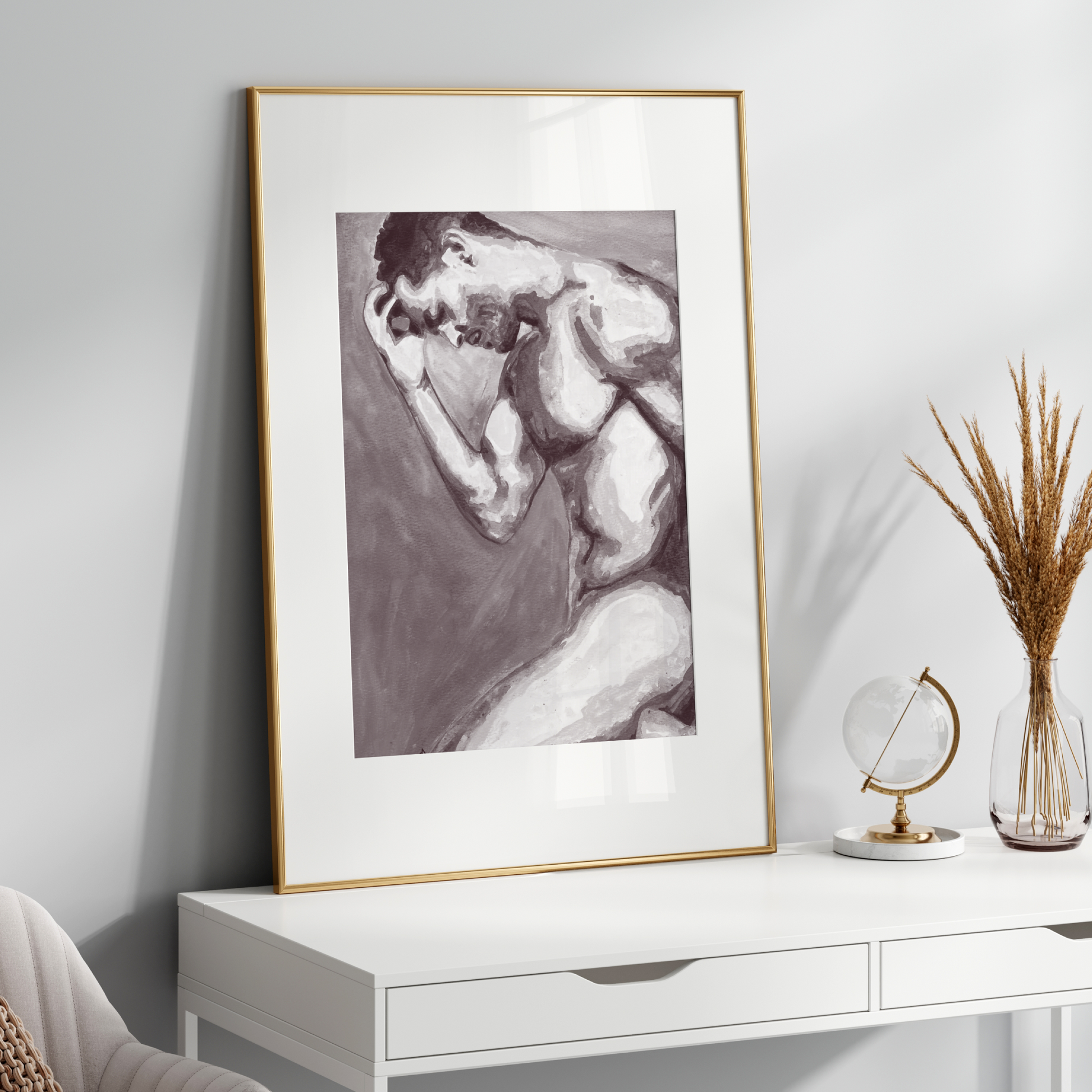 Framed black and white artwork on a white wall above a white console table with decorative items.