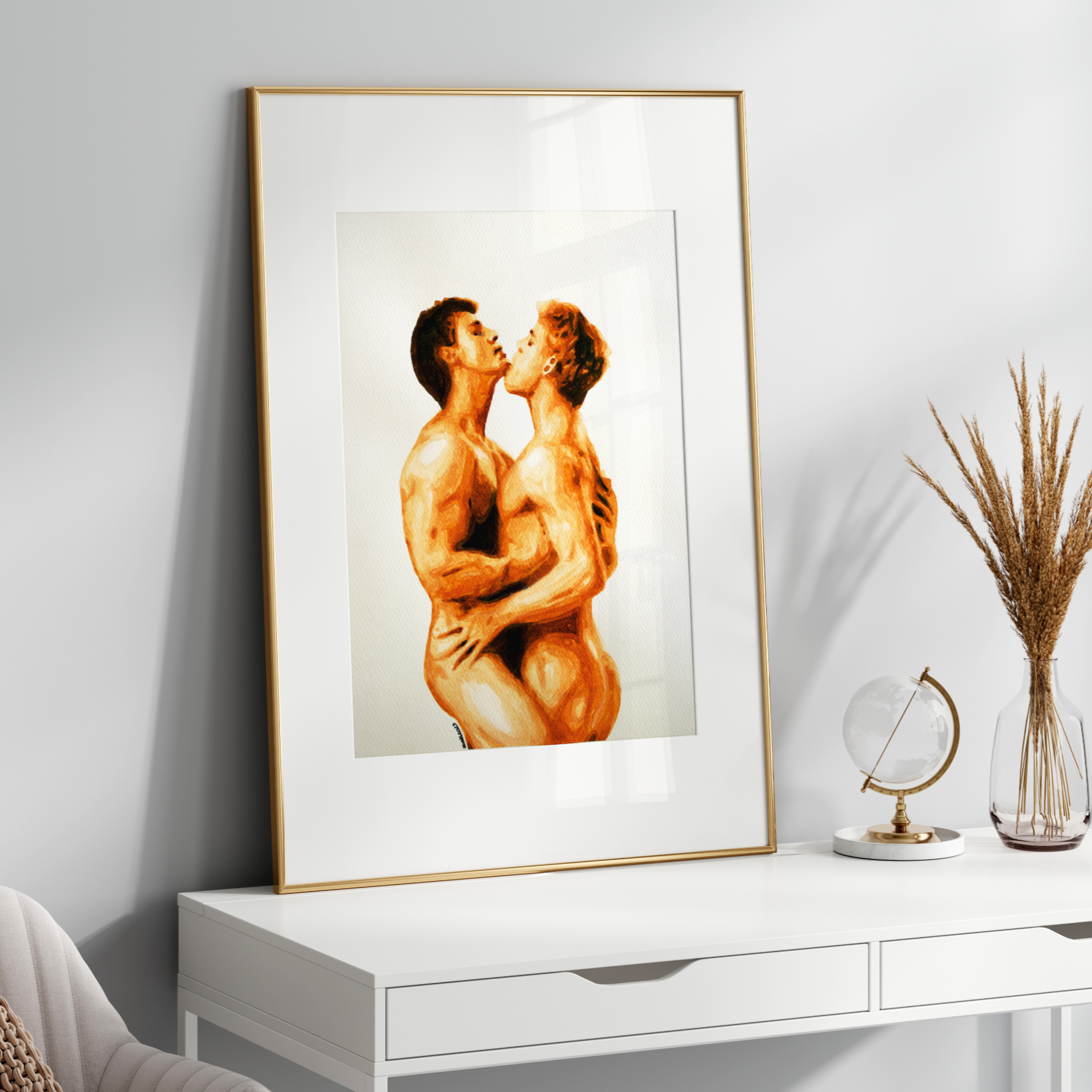 Framed artwork of two nude figures on a white wall above a white console table.