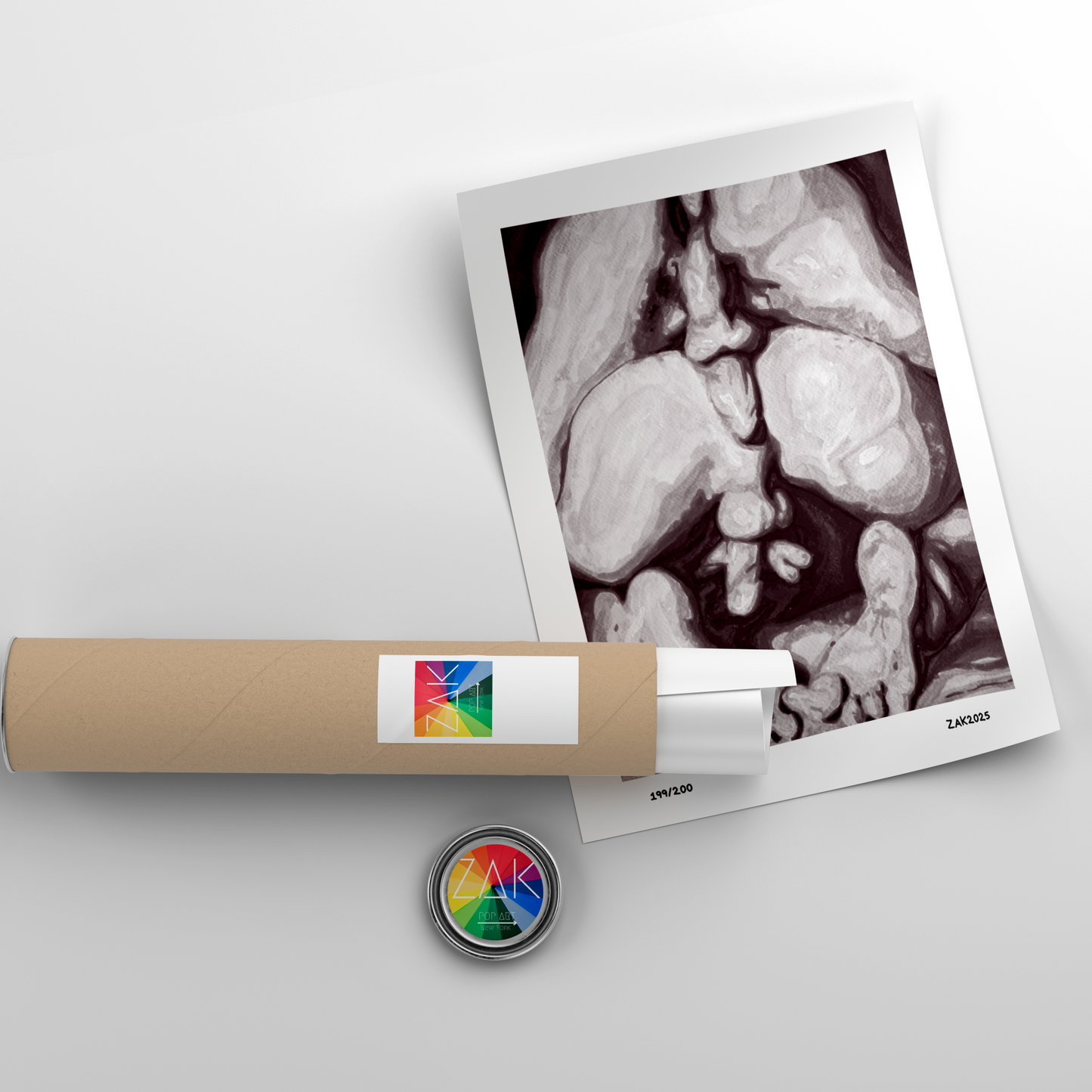 Polaroid-style photo of a babyogram with a roll of paper and a button on a light gray background