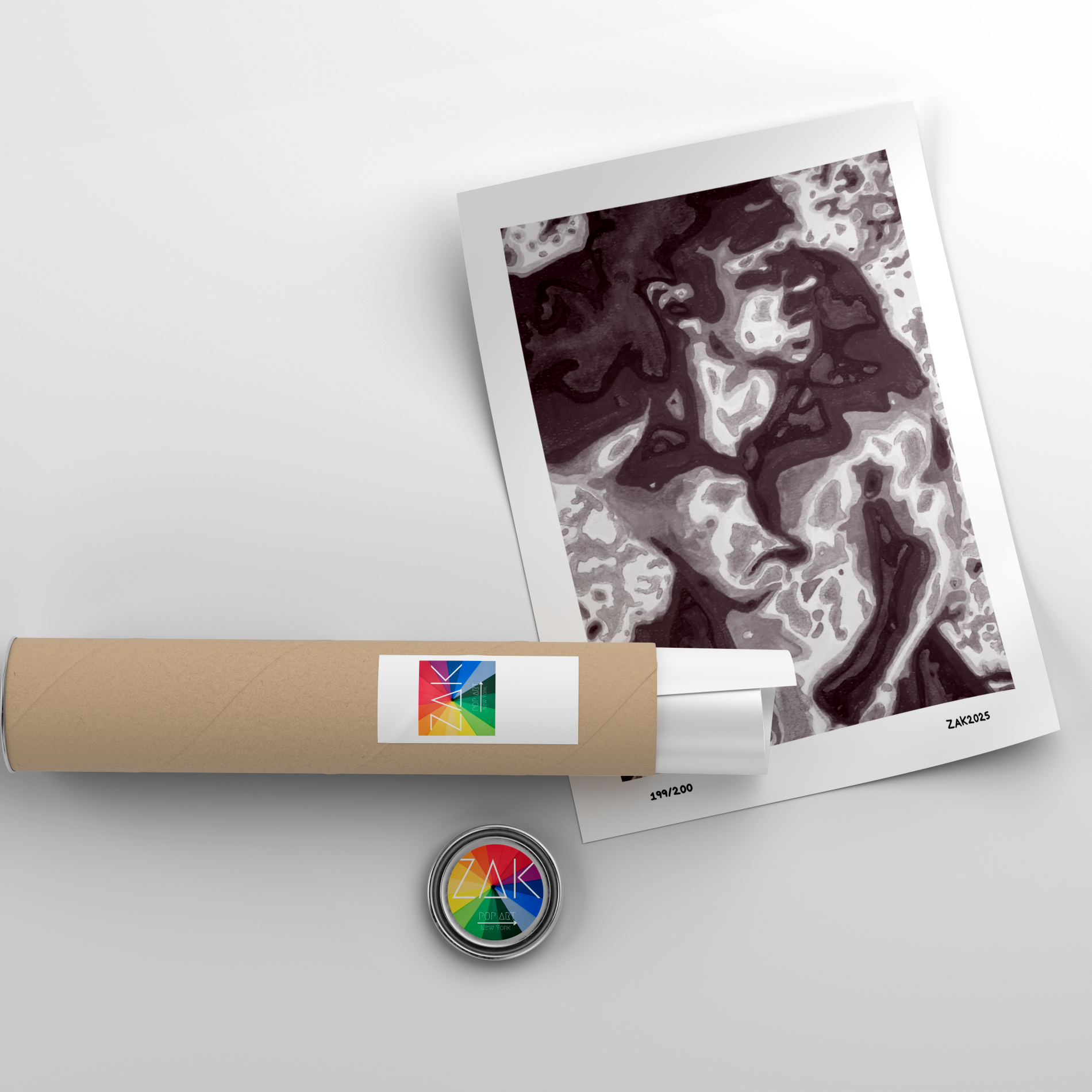 Roll of paper with a colorful label, a printed photo, and a circular object on a light gray background.
