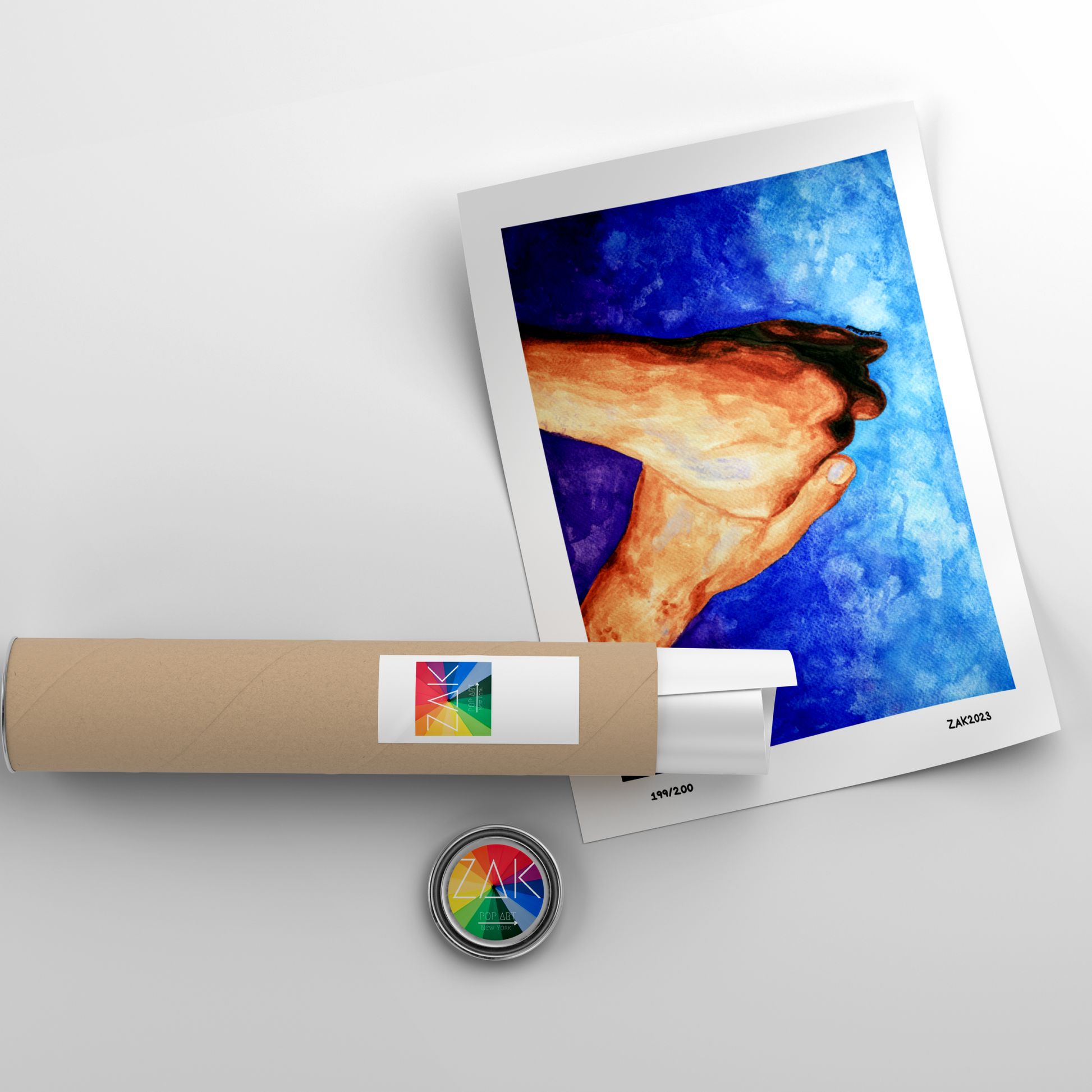 Rolled-up poster with a colorful design and a small round object on a light gray background